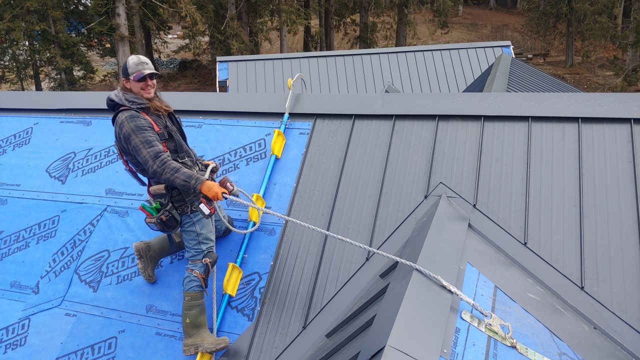 Residential Roofing Installation using 12" Prolok metal by Top Notch Roofing Inc