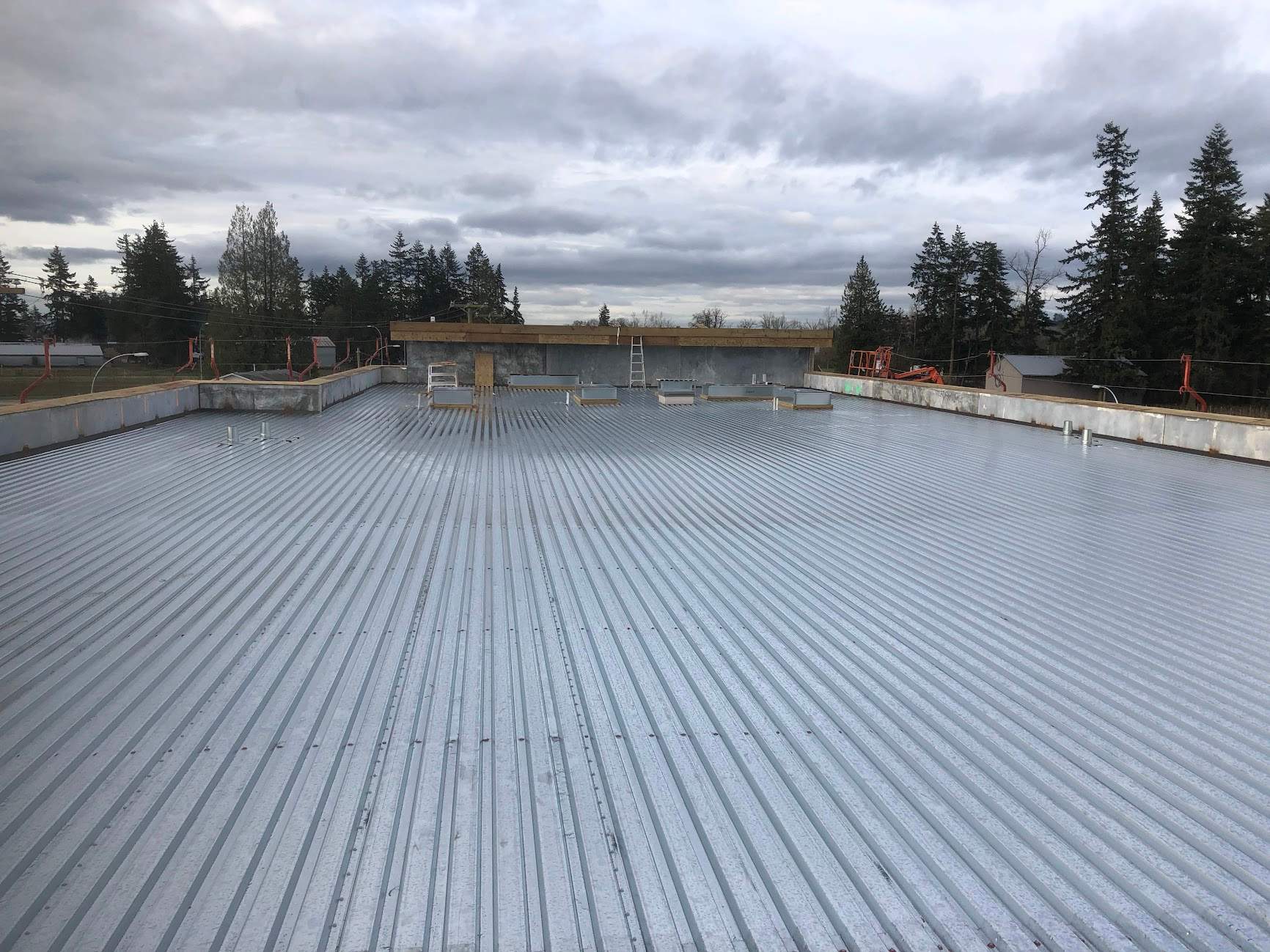 Commercial Roofing Installation using EPDM loose lay with balast by Top Notch Roofing Inc
