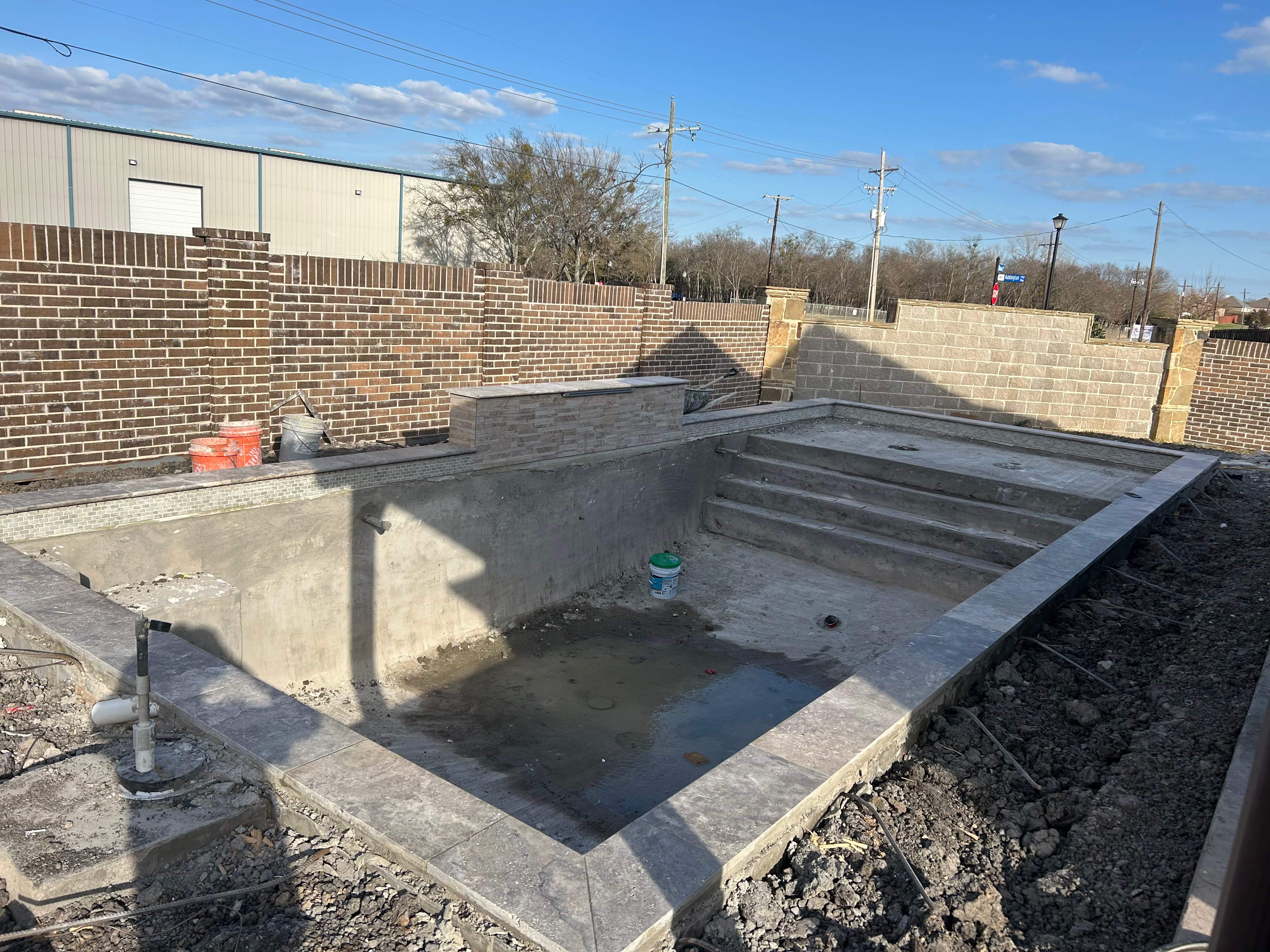 Rectangular Pool with Tanning Ledge and Waterfall by Pinnacle Pools and Spas - DFW