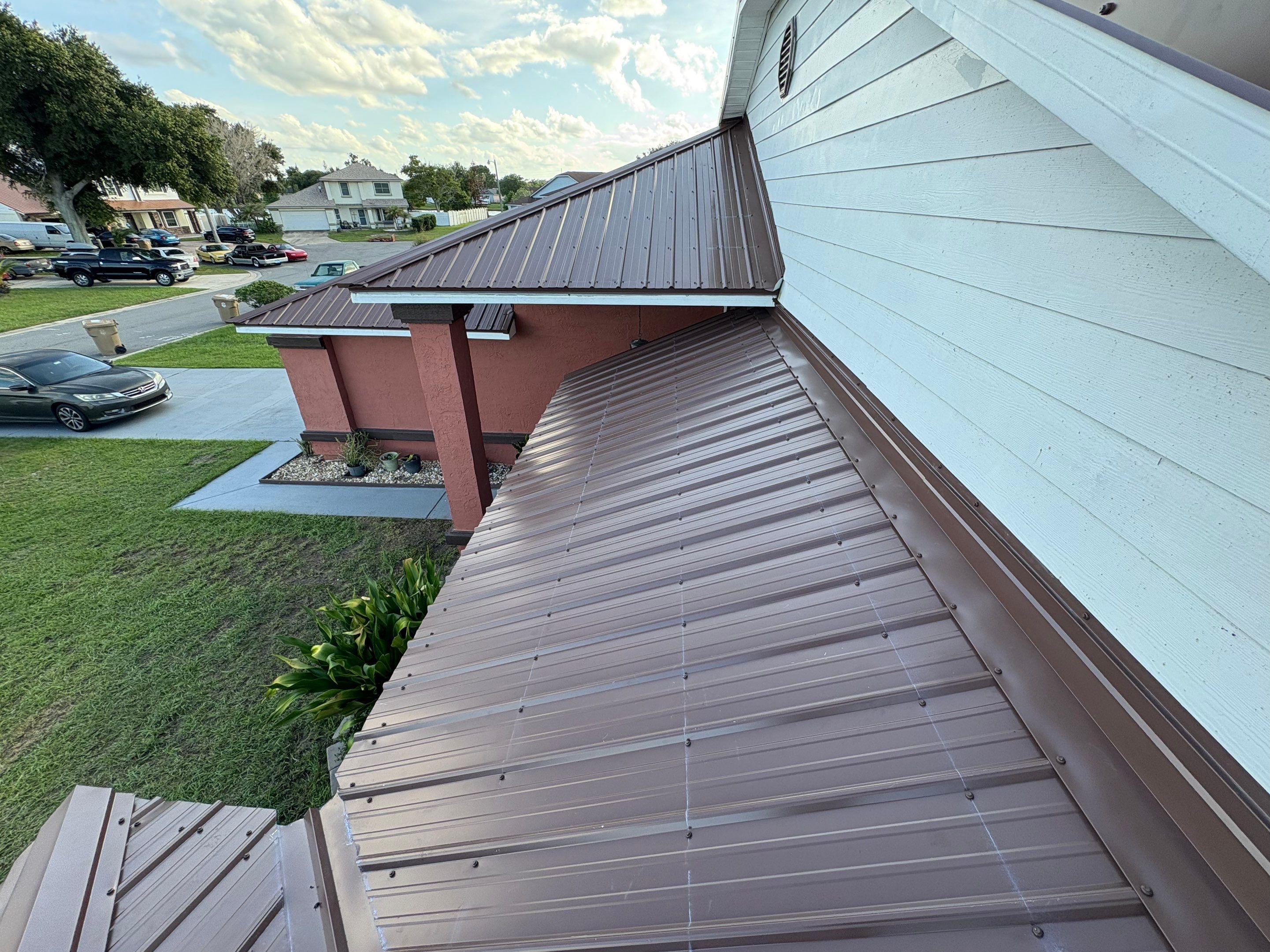 Residential Metal Roofing Installation and Gutter Replacement in Kissimmee by Pinnacle Roofing Group