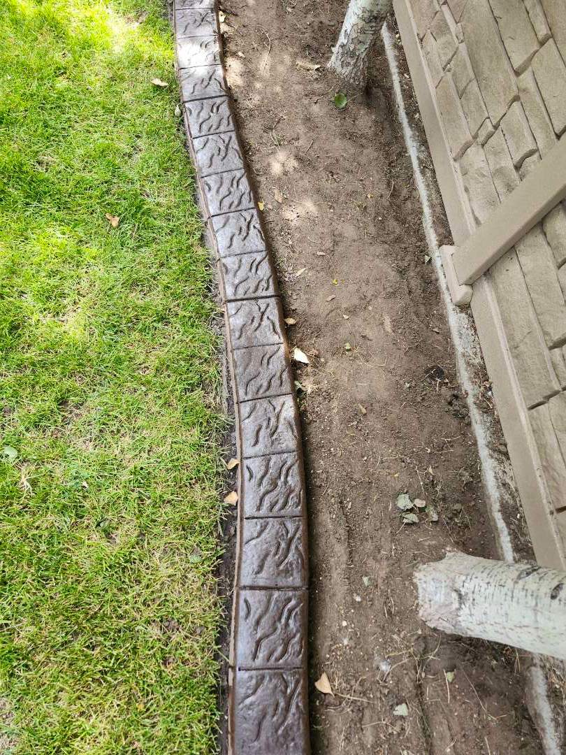 Decorative Stamped Concrete Landscape Edging Installation in Medicine Hat by Pump it Up Concrete Jacking