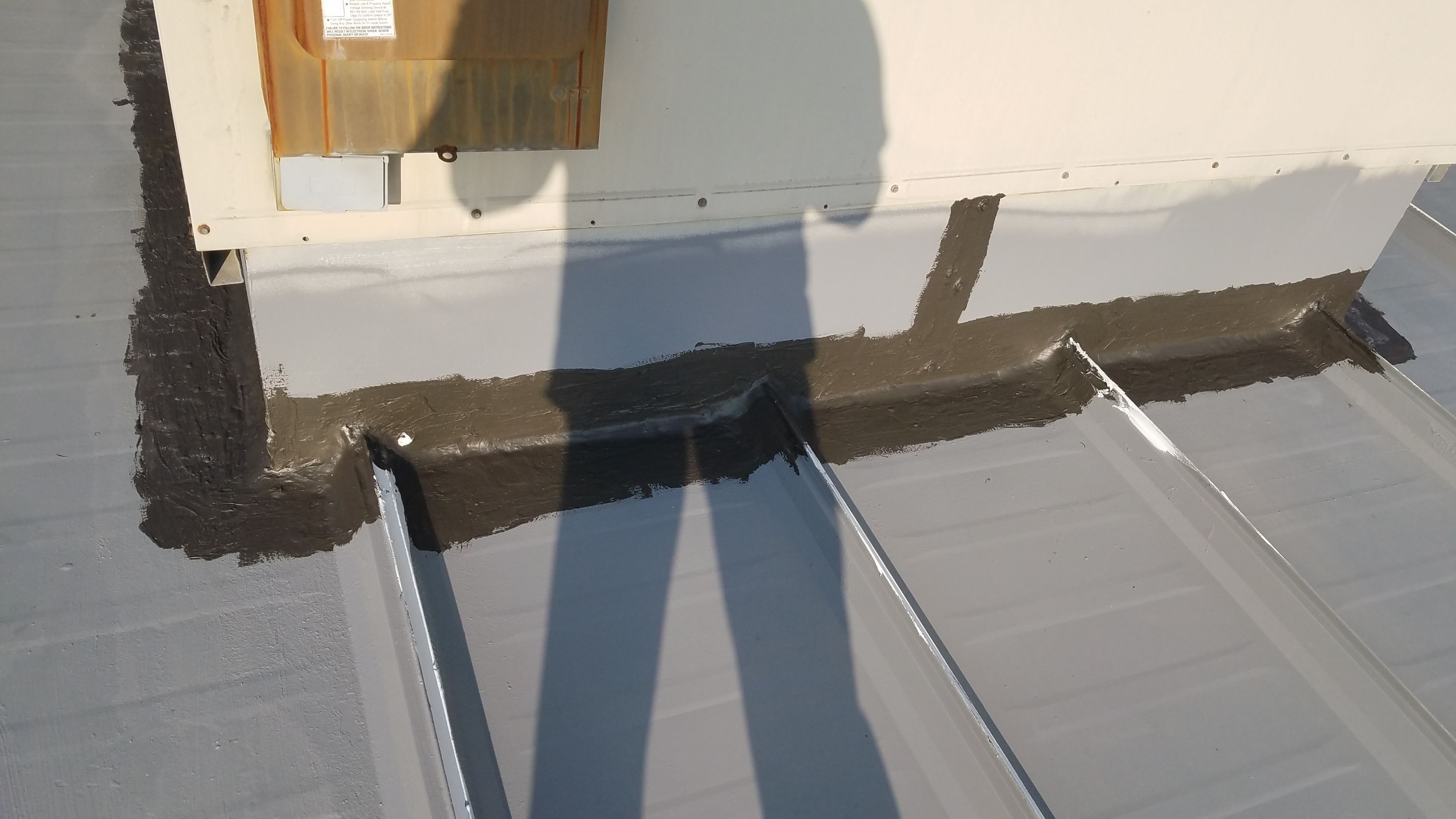 Commercial Metal Roof Coating by Gold Star Roofing LLC