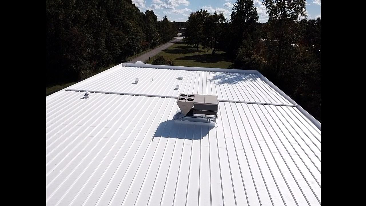 Commercial Metal Roof Coating by Gold Star Roofing LLC