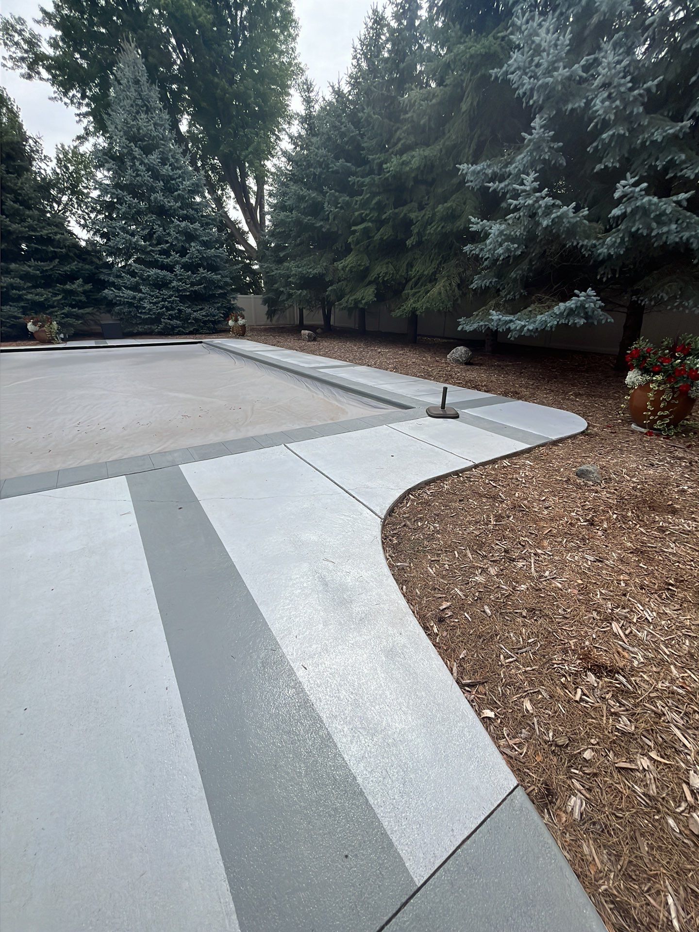 Decorative Concrete Pool Deck and Patio Resurfacing in Sioux Falls by Select Painting, Coatings & Garage Cabinets