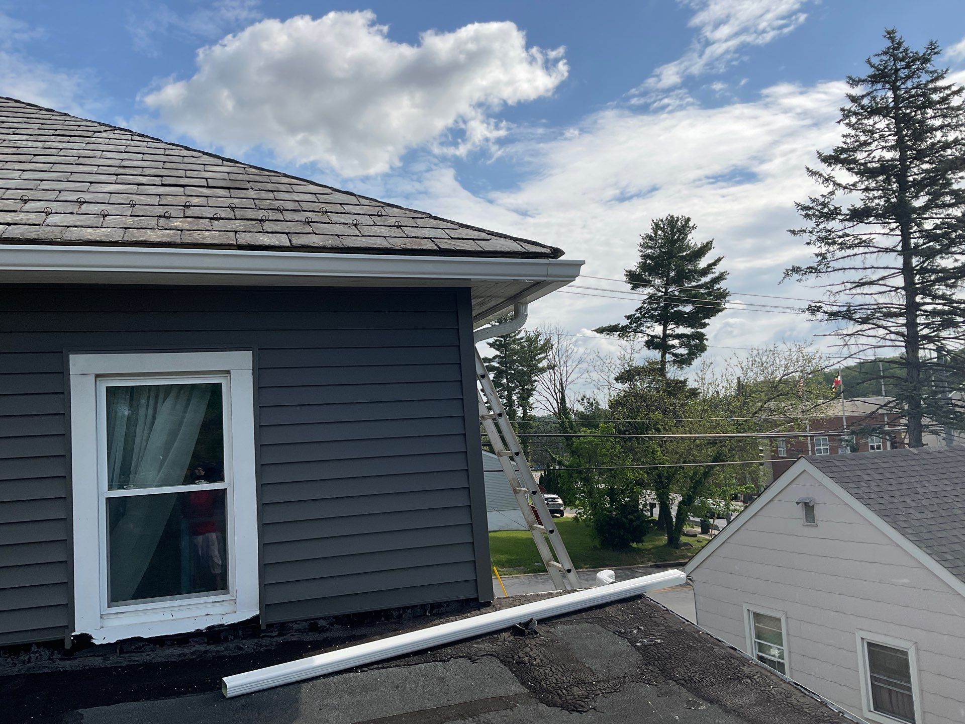 New siding & New Gutters by Alpha Design Services