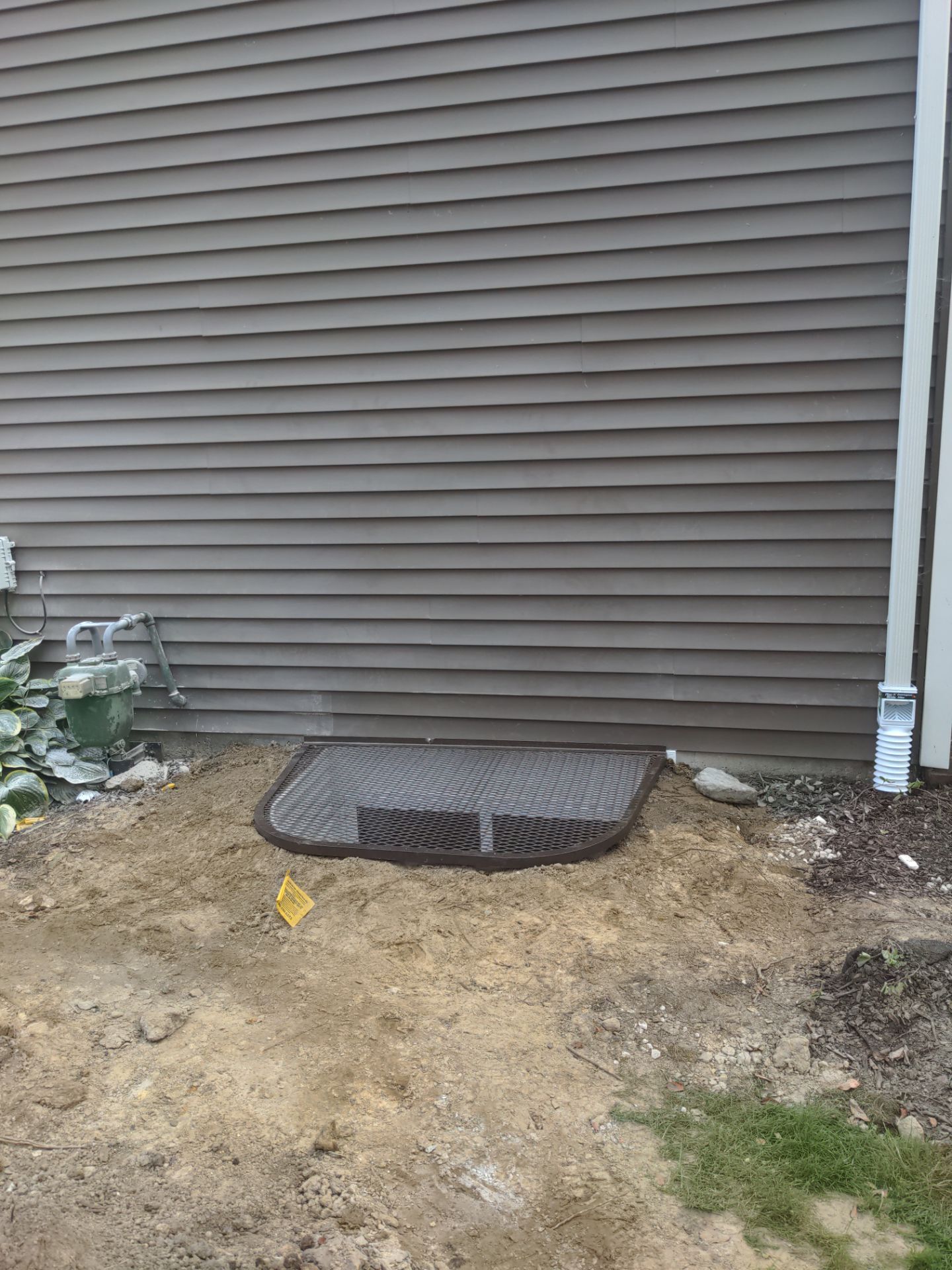 Interior Basement Waterproofing System and Egress Window Installation by Toledo Basement Repair 