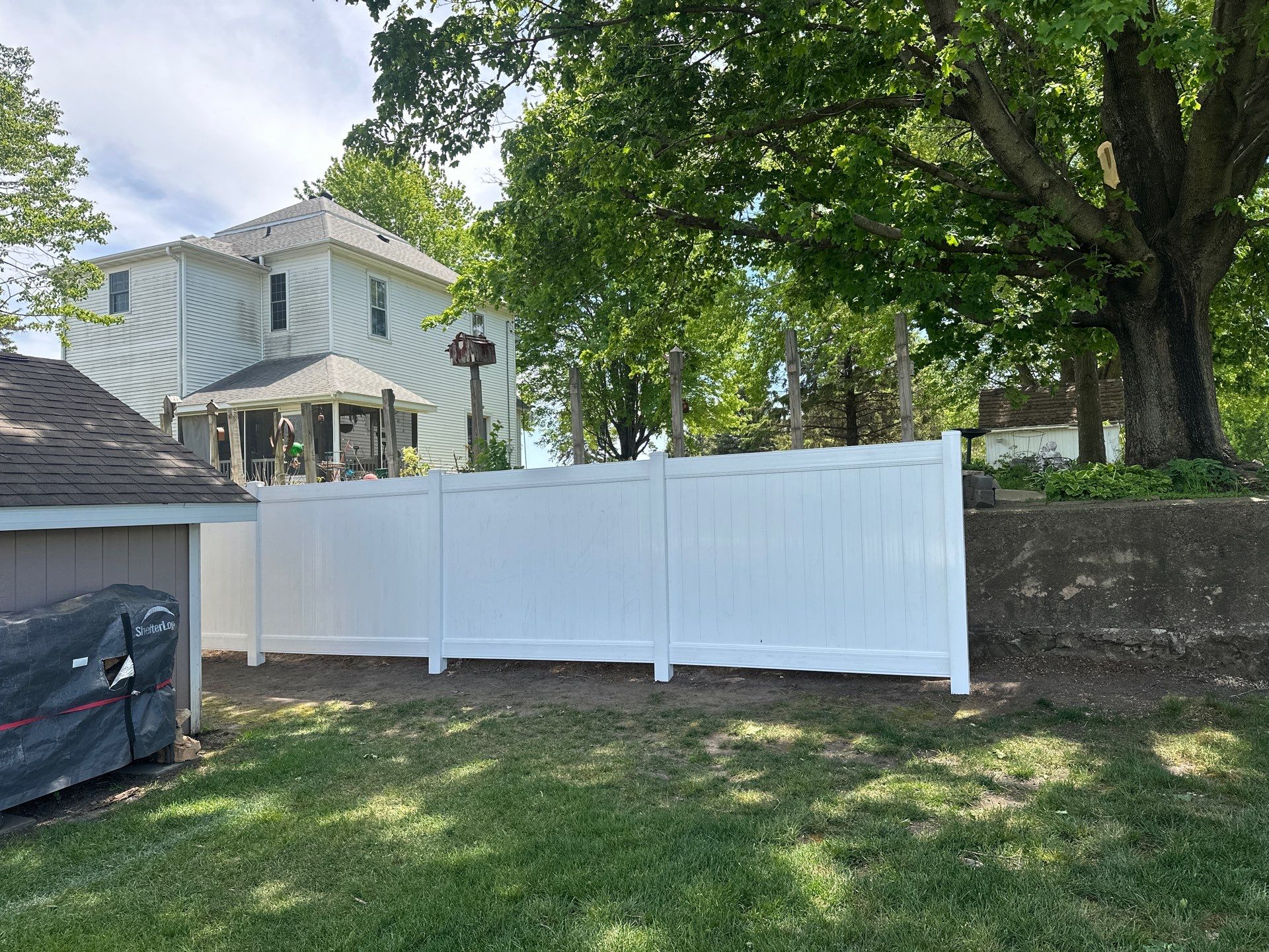 White Vinyl Privacy Fence Installation in Lawler, IA by Perfect Picket Fence and Stain