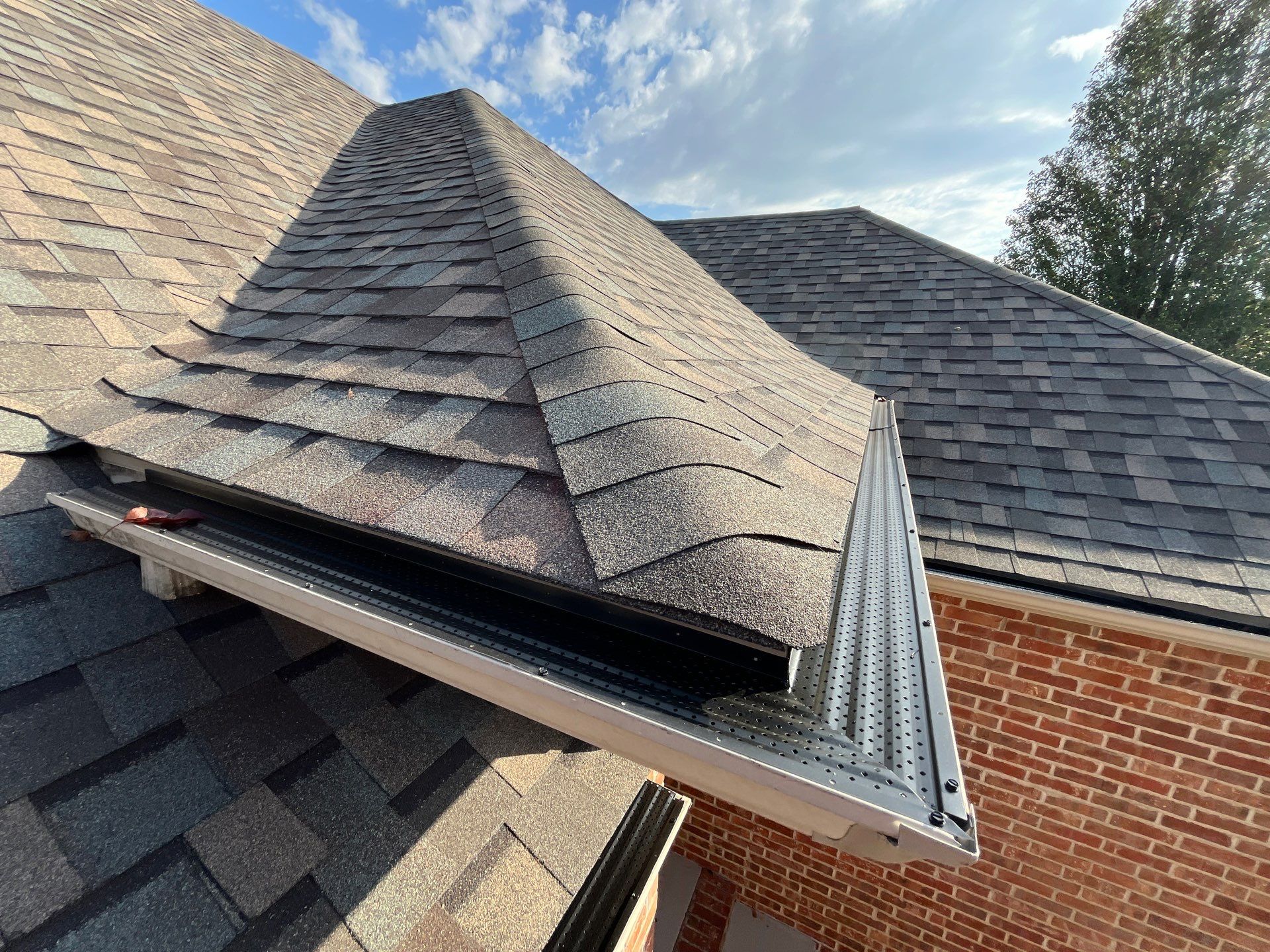 Residential Roofing + Downspouts & Gutter Guards Install  by Titan Commercial & Residential Roofing 