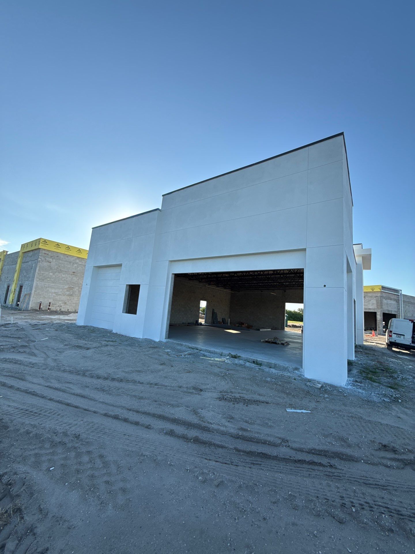 Downspout Installation using collector head in Cape Coral FL by Gutter Professors