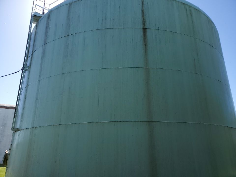 Water tank cleaning by Northern Power Washing LLC.