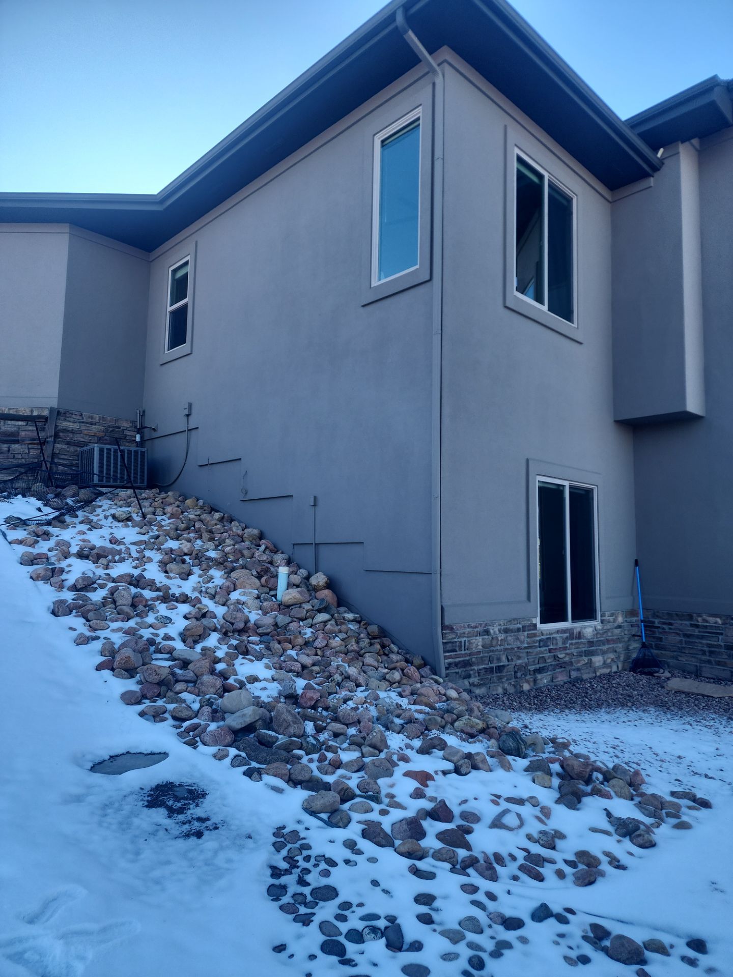 Castle Rock Elegance: White Stucco Exterior with Bold Tricorn Black by J&M Painting LLC