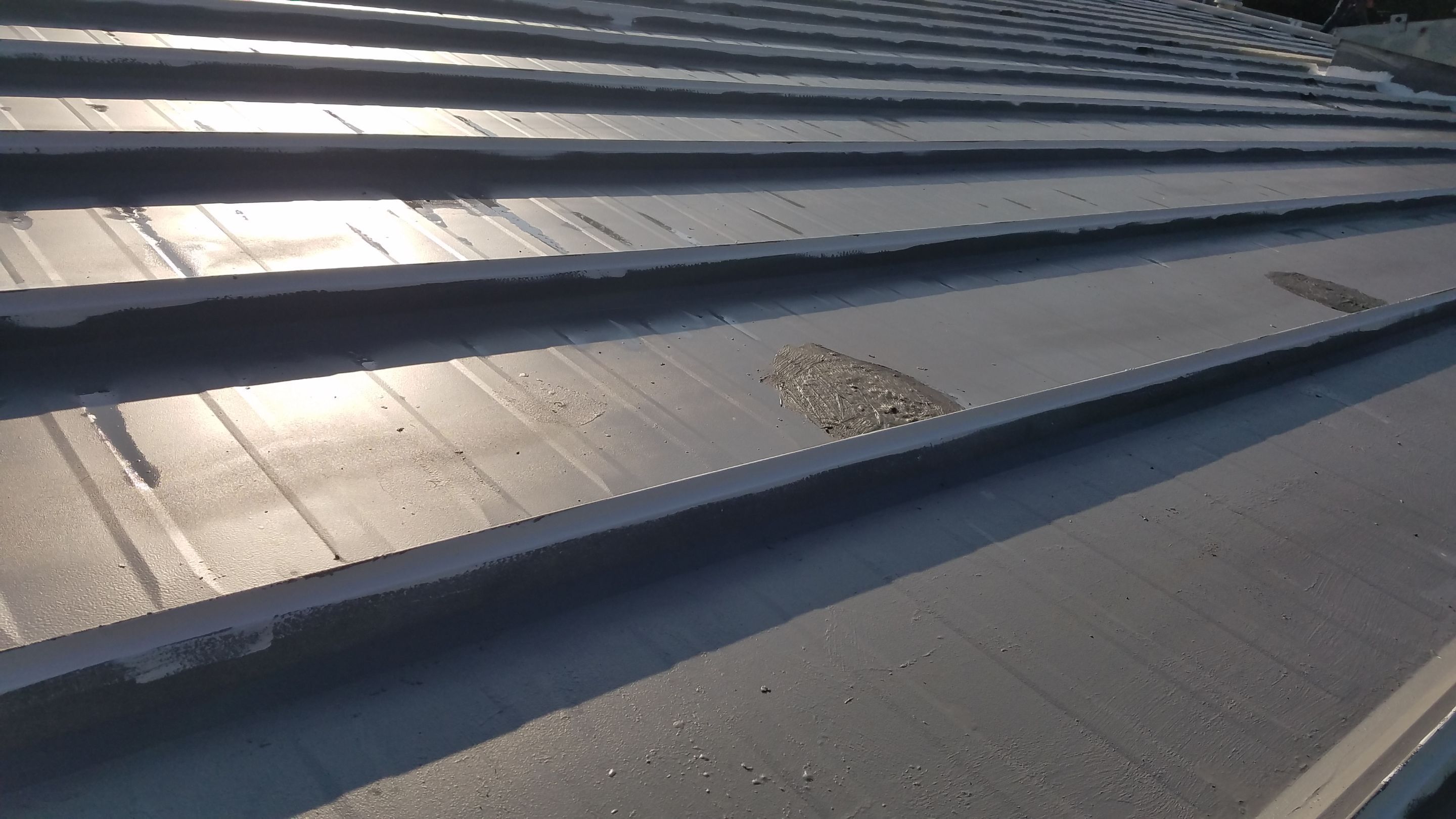 Commercial Metal Roof Coating by Gold Star Roofing LLC