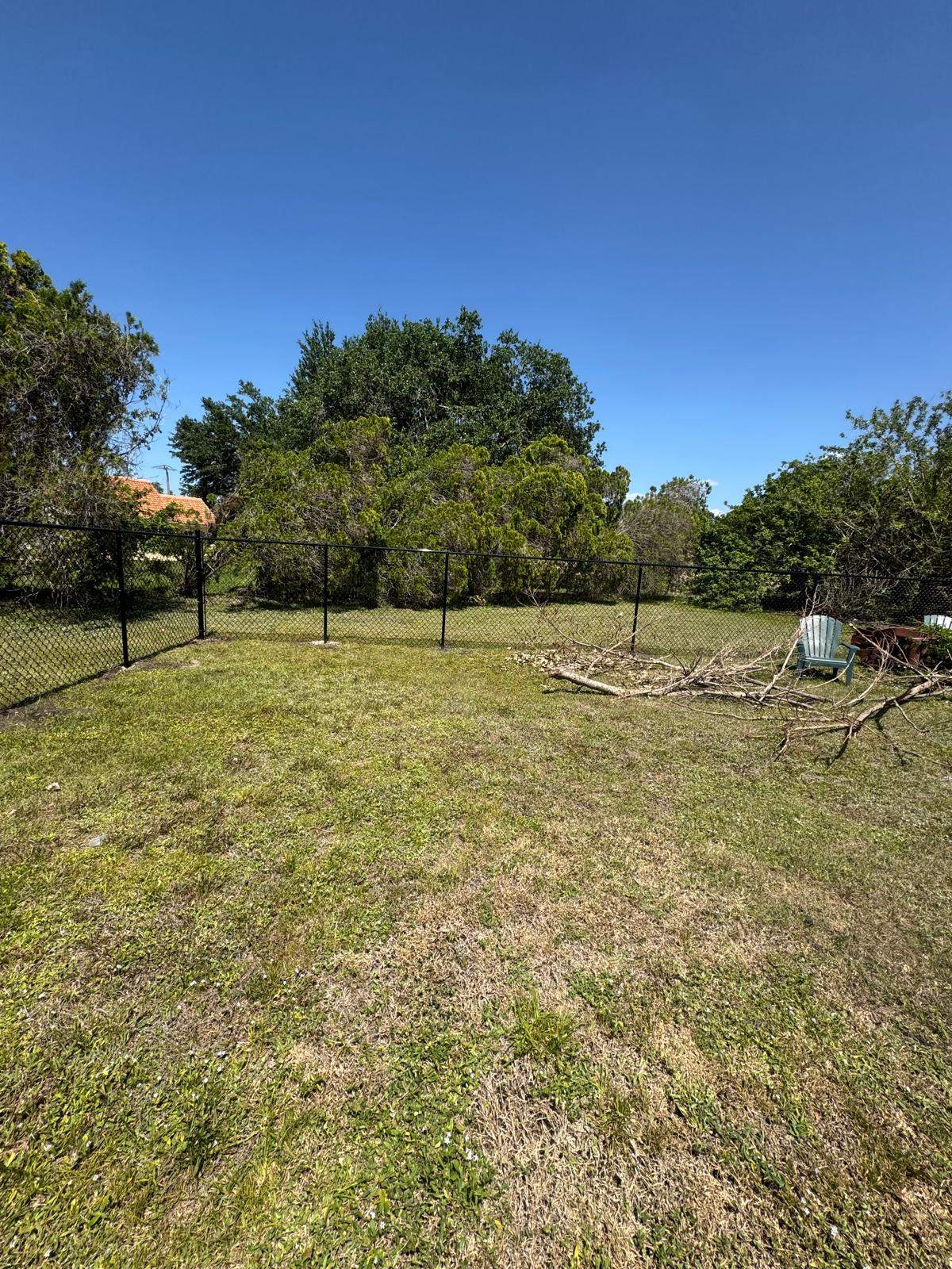 Black Chain Link Residential Backyard Fence Installation in North Port by True Fence LLC