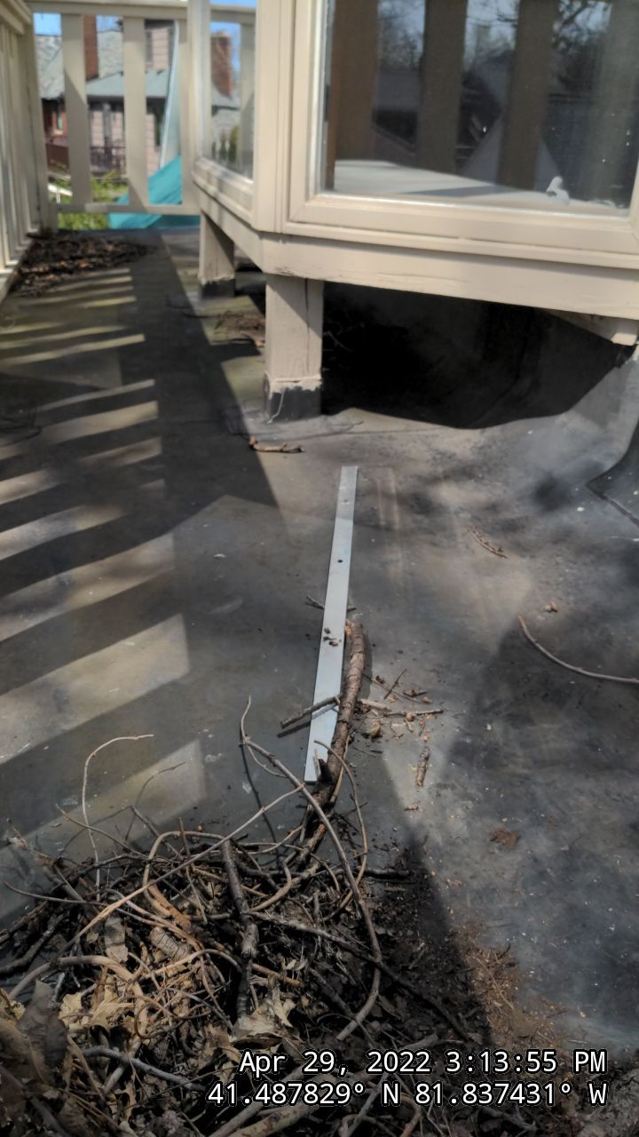 Residential Roofing Installation, Dec-tek walk-out porch roof, siding on garage by Absolute Roofing and Construction