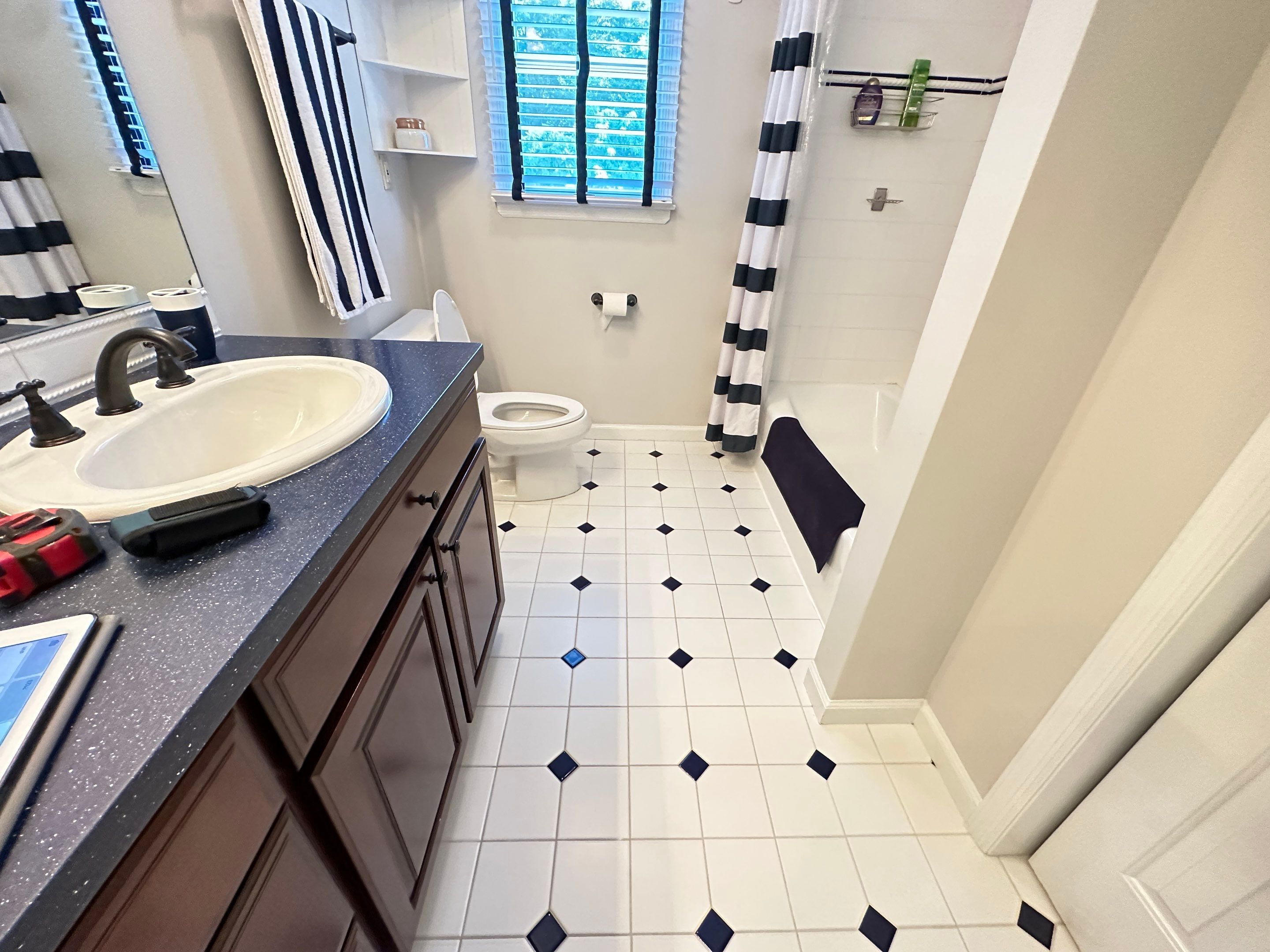Bathroom Remodel using LVP Flooring by Home Concepts Construction