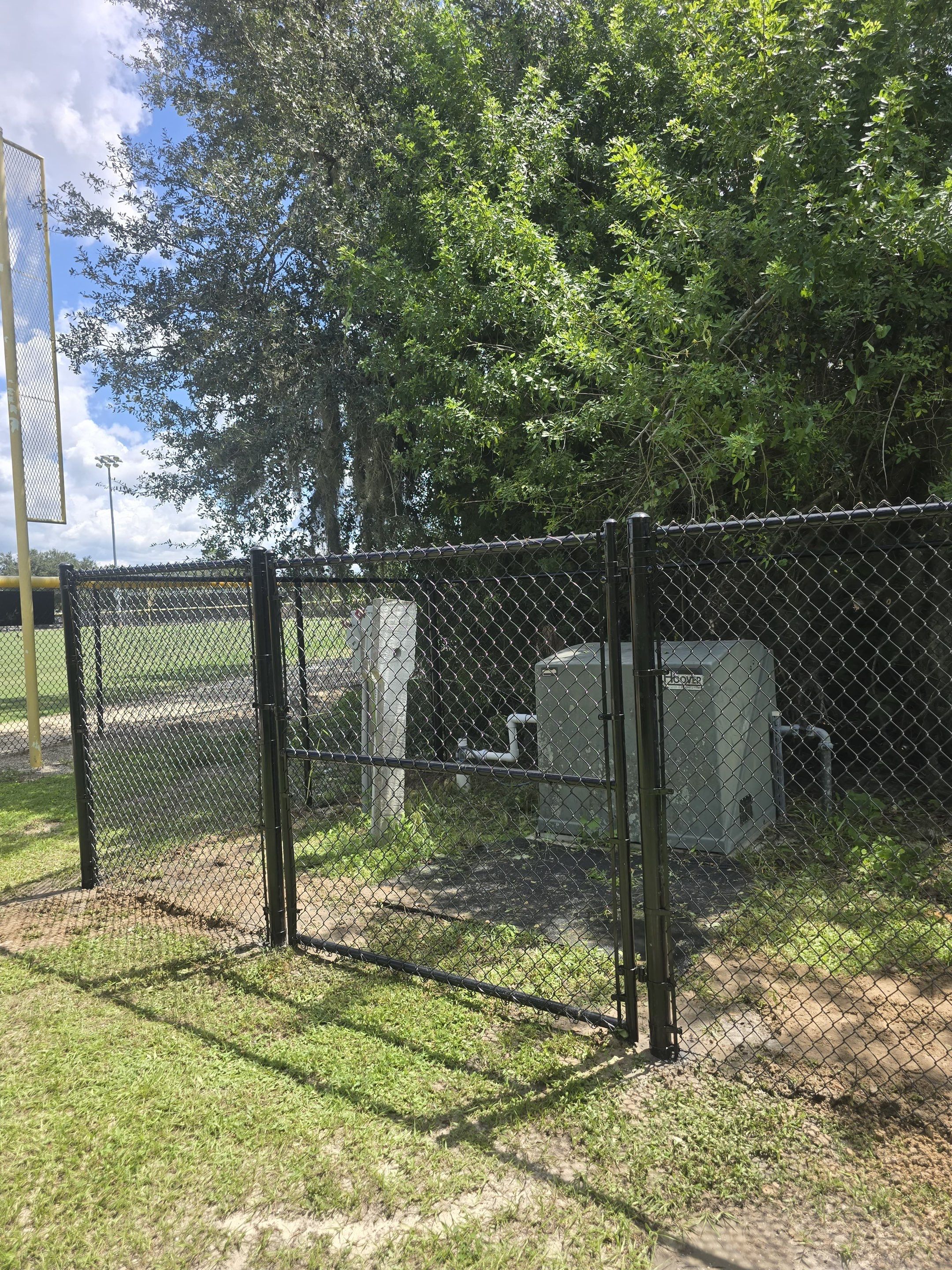 Commercial Black Chain Link Fence Installation in North Port by True Fence LLC