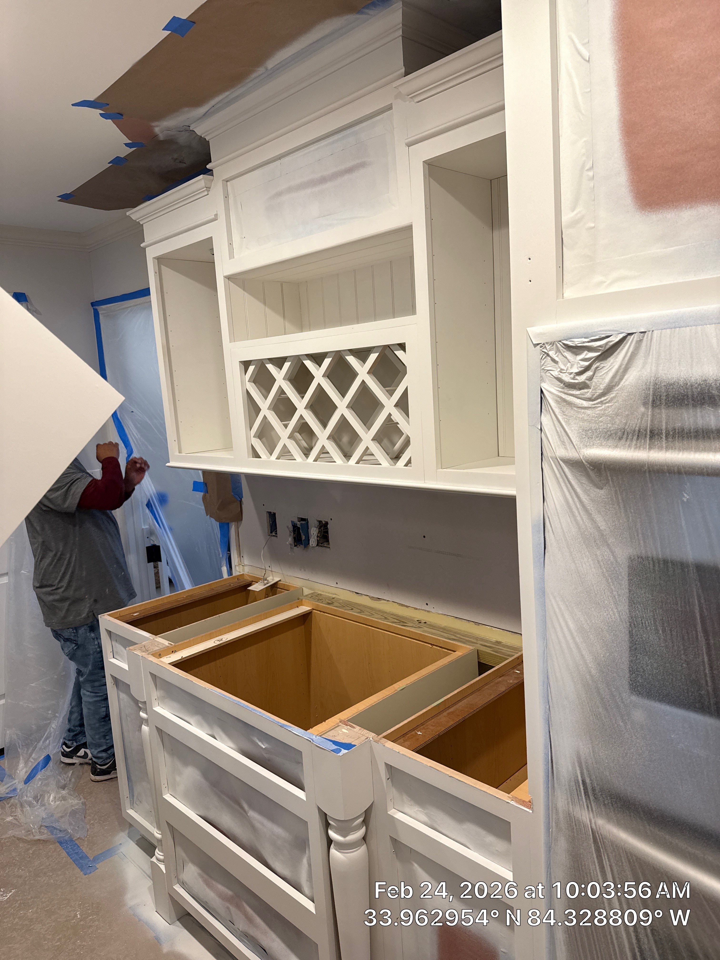 Kitchen Remodel in Dunwoody Featuring White Cabinetry and Blue Island by Heart & Home Kitchen & Bath Remodeling LLC