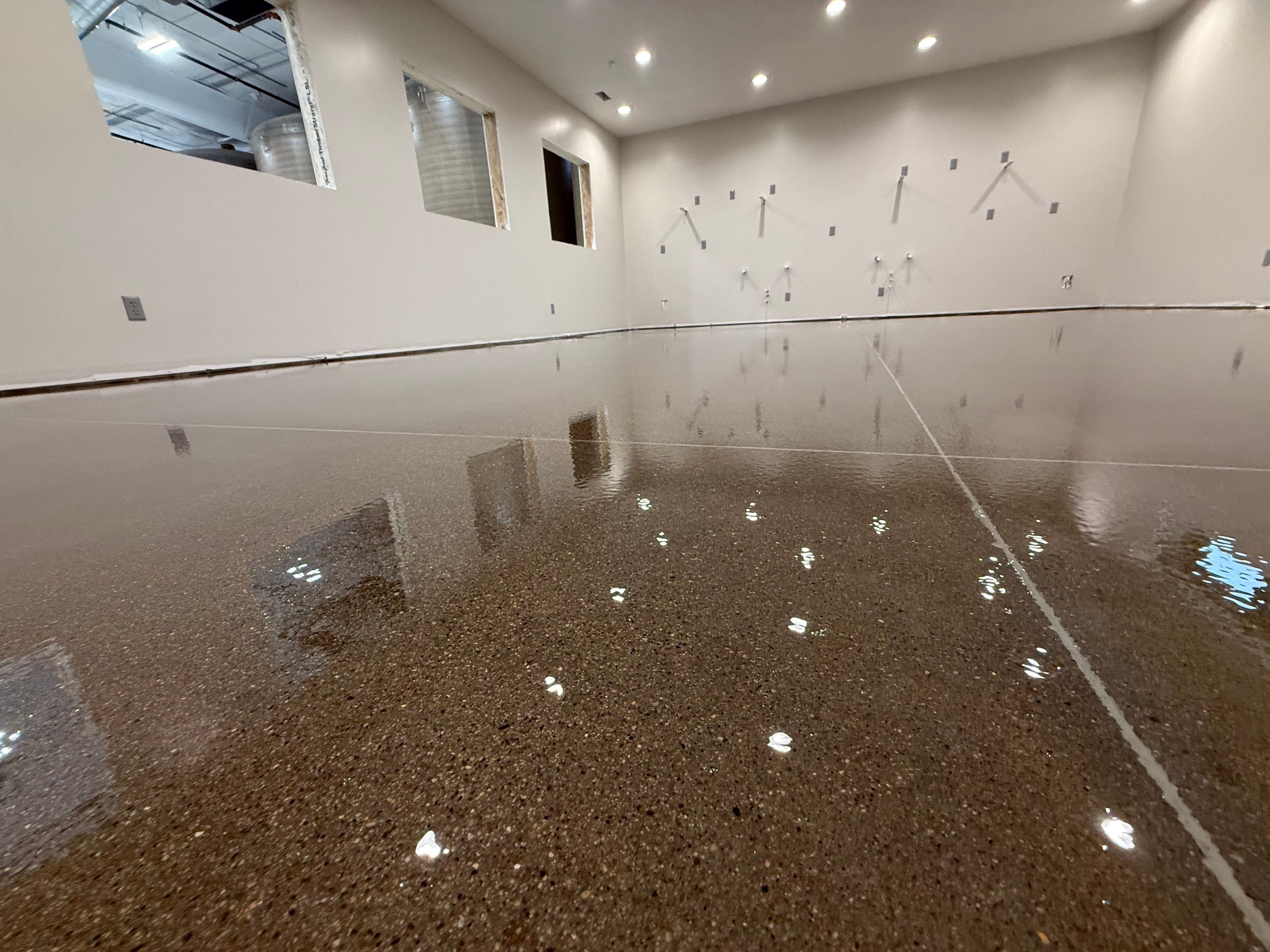 Industrial Concrete Polishing and Coating for Large Manufacturing Warehouse by Select Painting, Coatings & Garage Cabinets