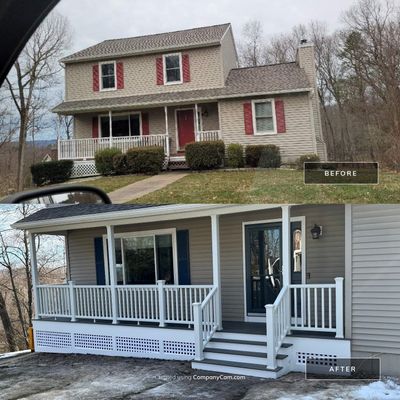 Replacement front porch using Trex Tropical Island mist and White composite railings. Includes lattice bottom. 