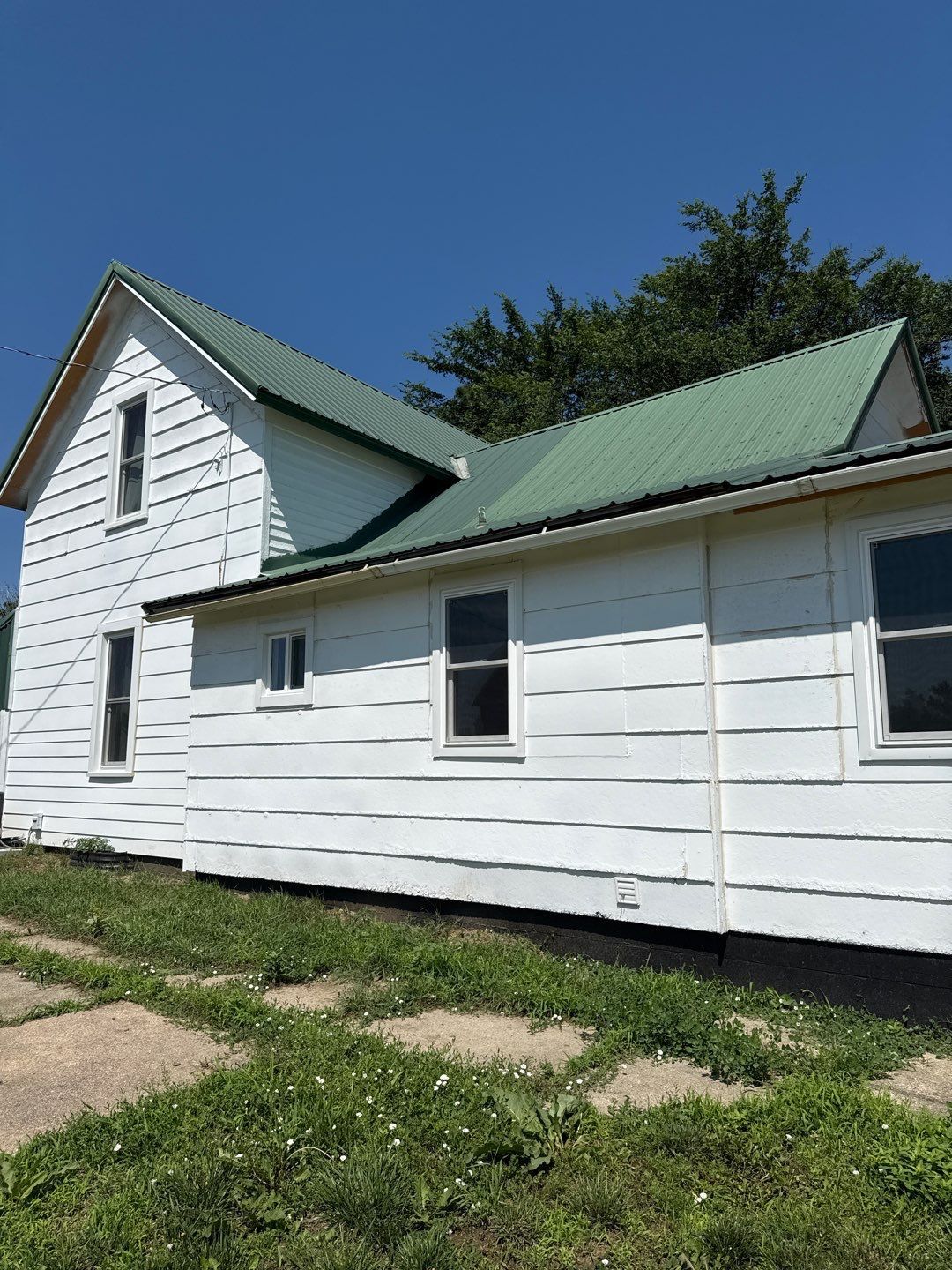 Standing-Seam Metal Roof and Vinyl Siding in Pender, NE by Crows Roofing LLC