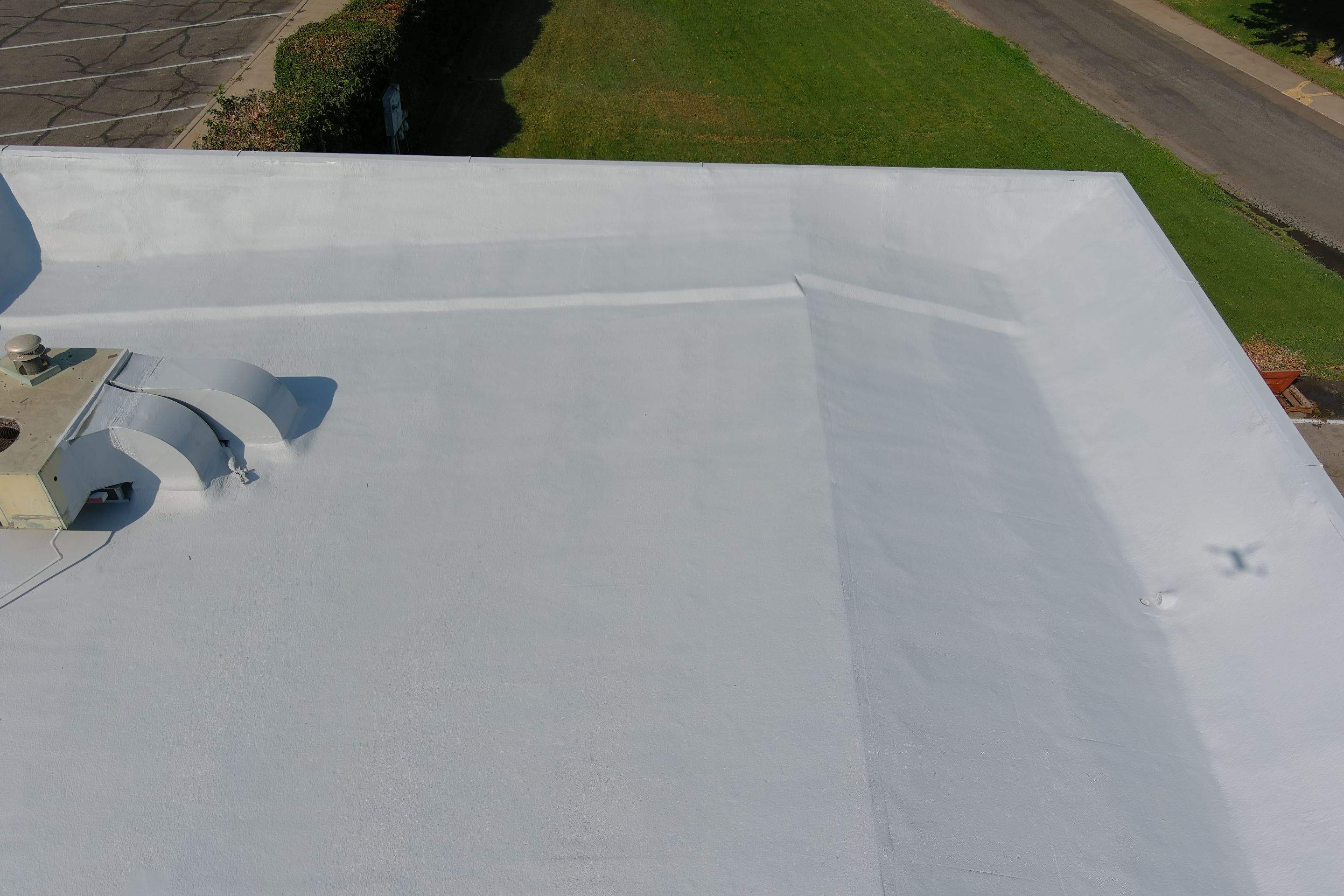 Commercial Roofing Installation using General Coatings acrylic coatings and spray foam by Straight Edge Roofing Inc