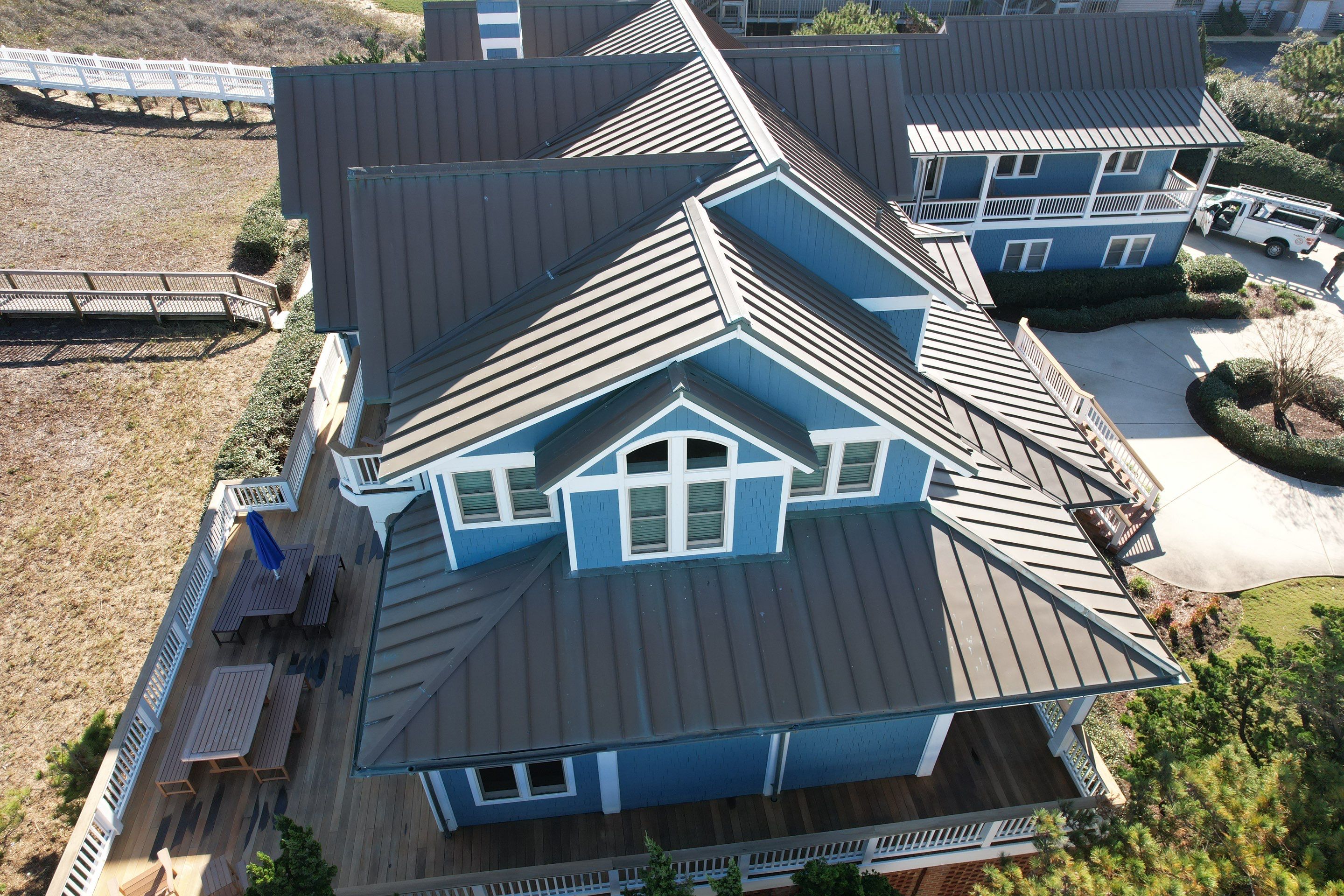 Large Metal Roof Transformation by Gallop Roofing & Remodeling, Inc.