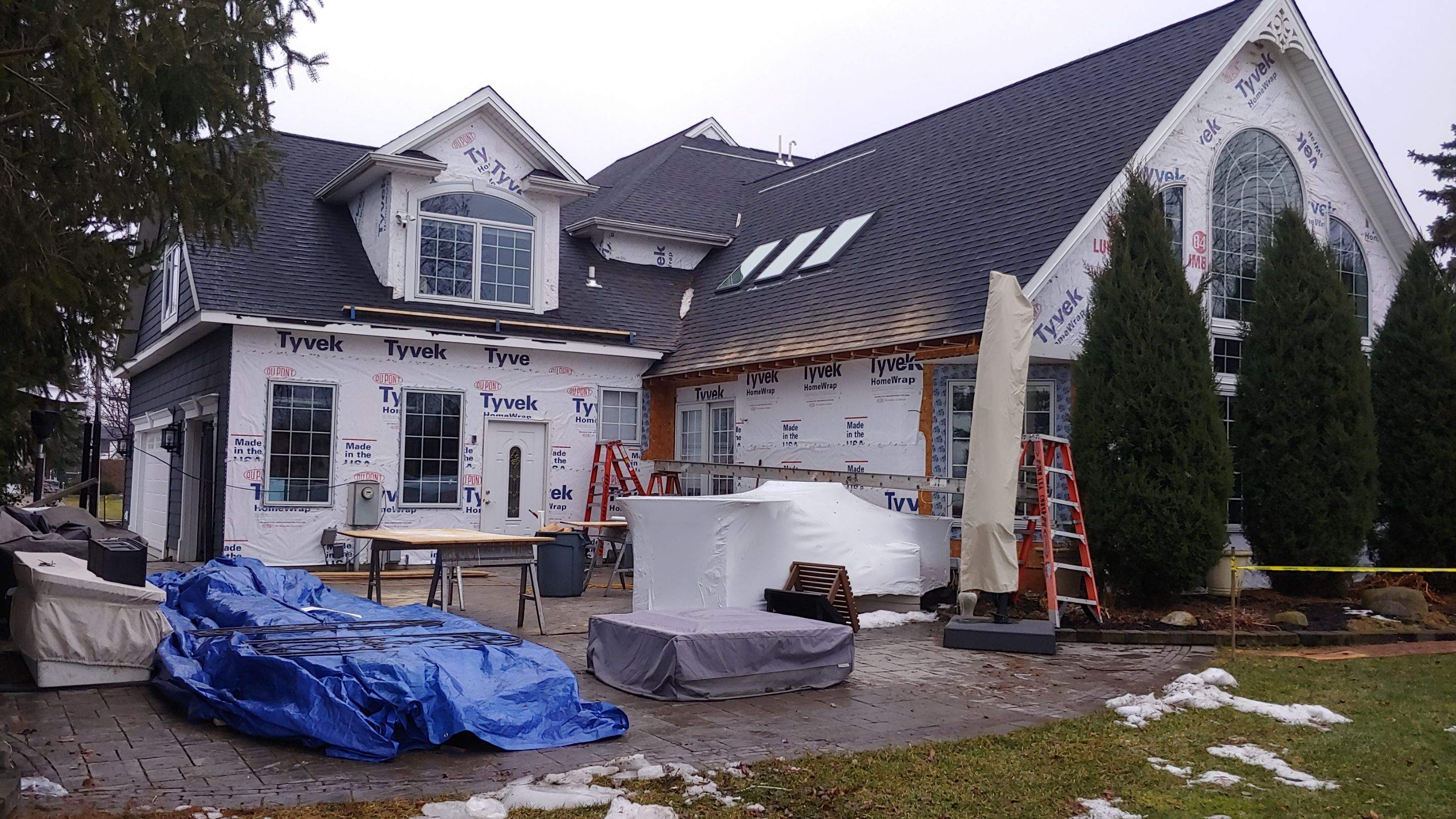 Exterior Renovations- Siding, Concrete, Railings, and Entry Door  by Ivy Lea Construction