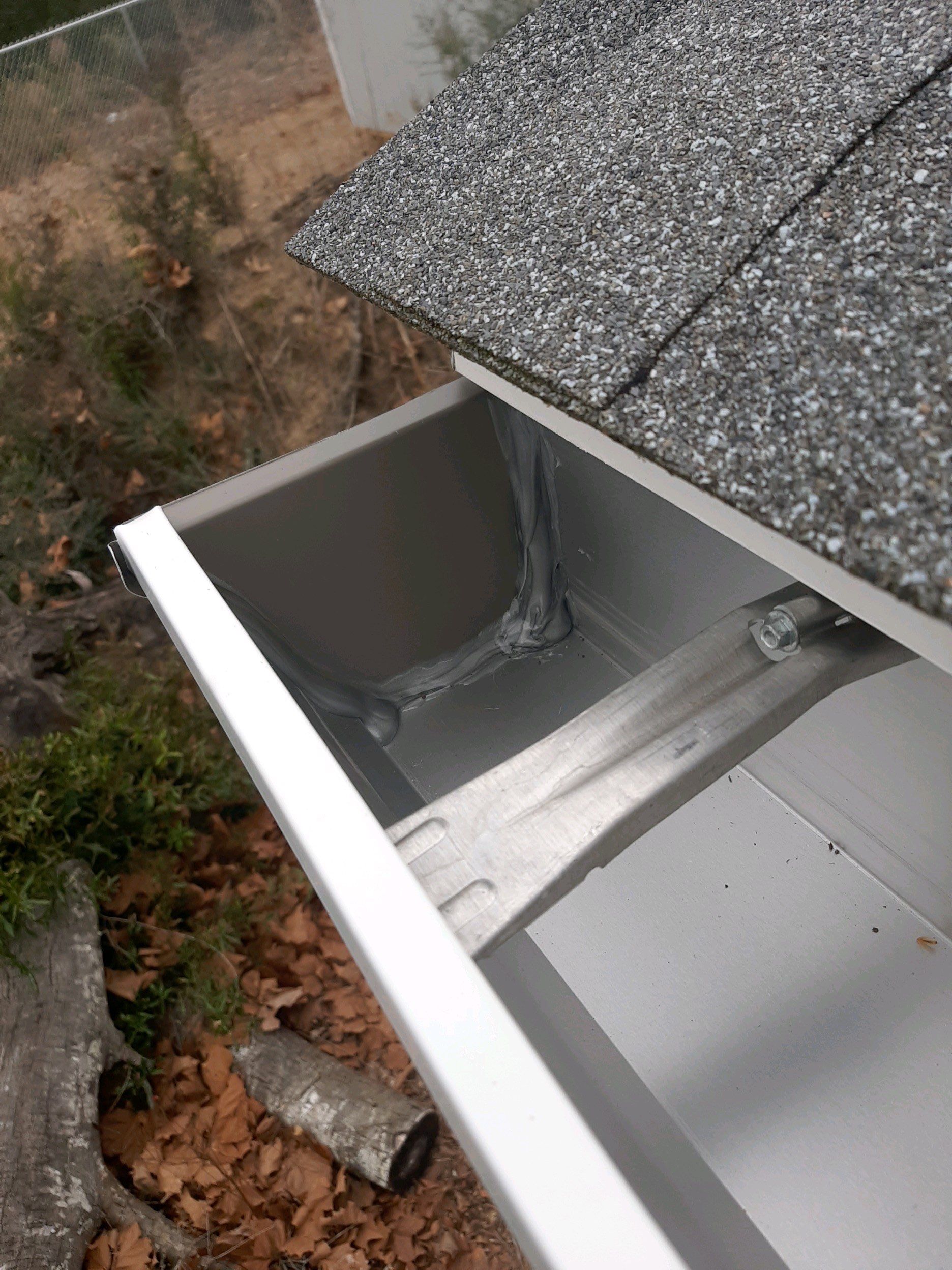 Gutter Installation using White Seamless Gutters by Gutter Professors