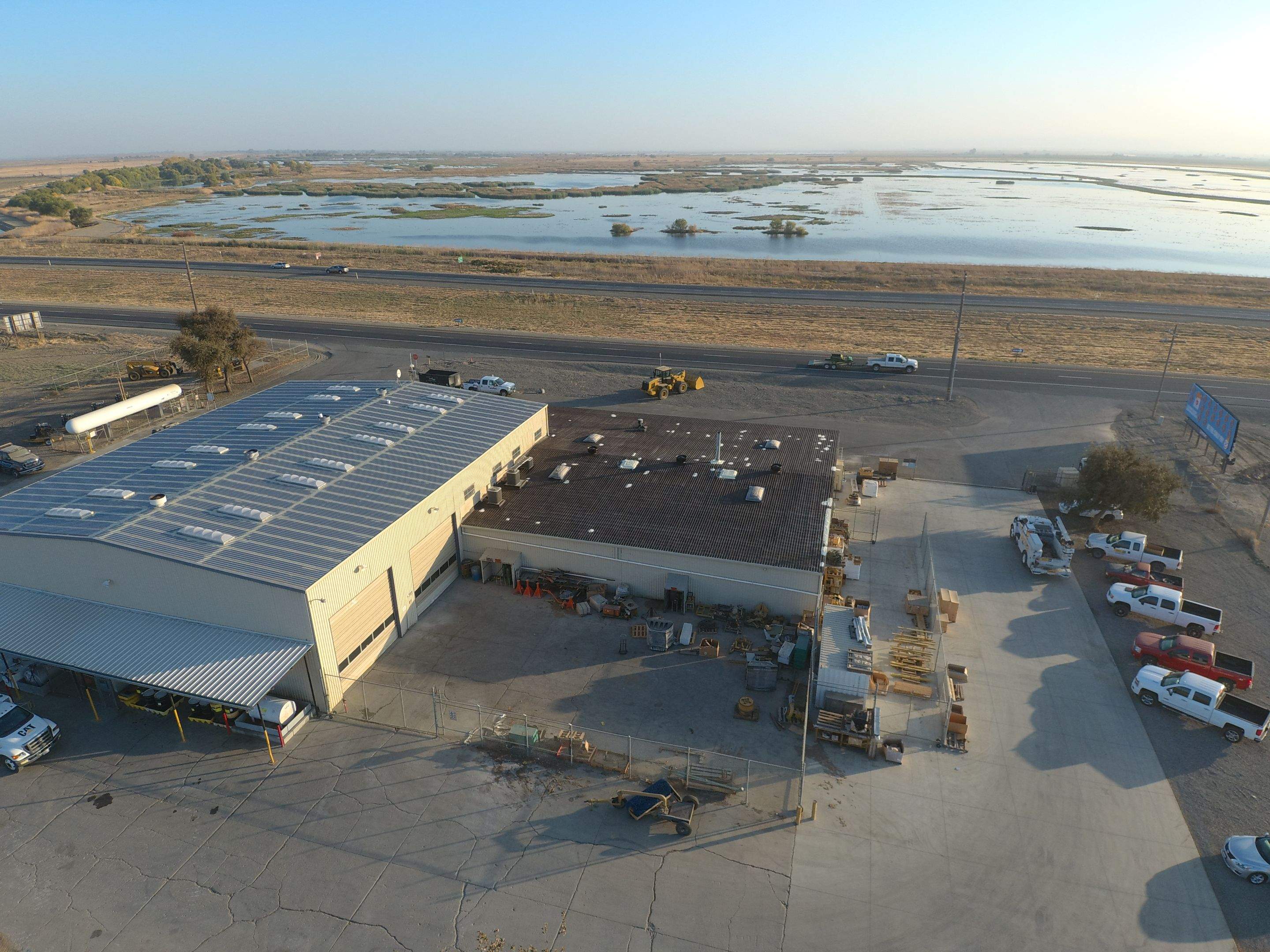 Metal roof restoration on commercial roof using Conklin Benchmark/ PUMA XL acrylic coatings over metal and foam by Straight Edge Roofing Inc