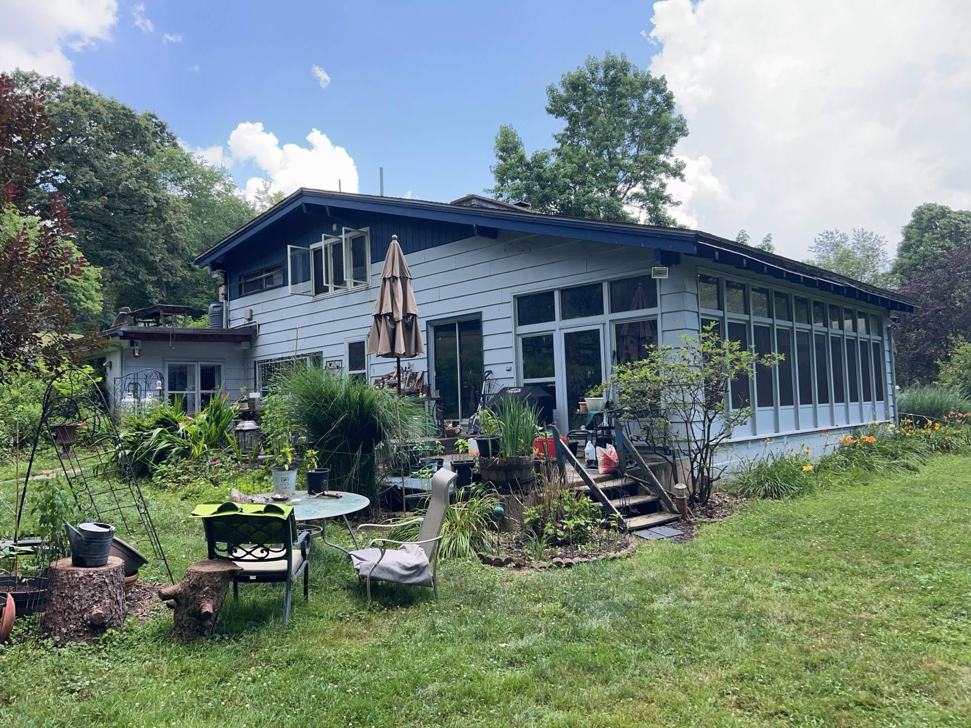Two-Tone Siding and Sunroom Exterior Remodel in Beaver Falls by Ideal Siding Pittsburgh