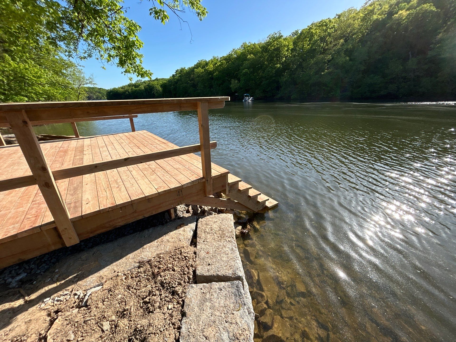 Lakeside Deck & Fire Pit by Loch Ness Landscaping, LLC