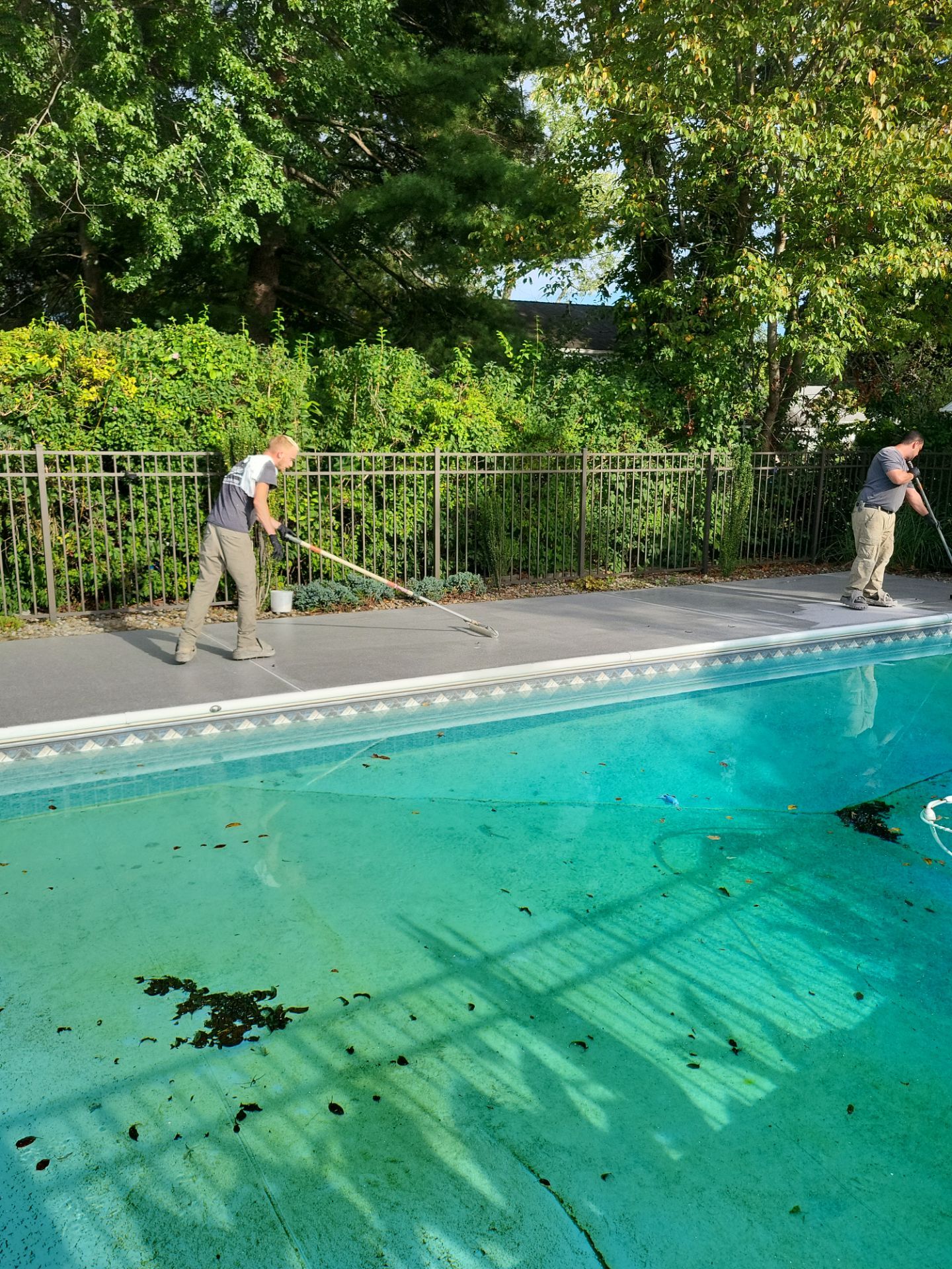 Blue Granite Pool Patio Concrete Coating in Lincoln Park by Spectrum Painting, LLC