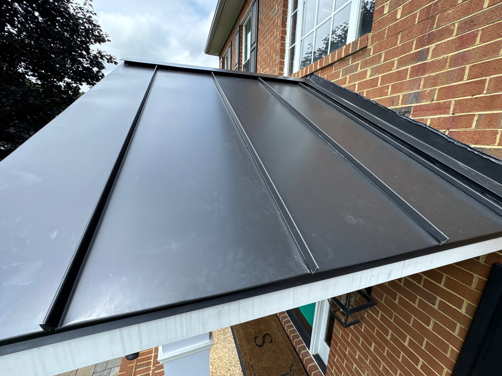 Standing Seam Metal Porch Roof Installation in Mechanicsville, VA by Cade Construction