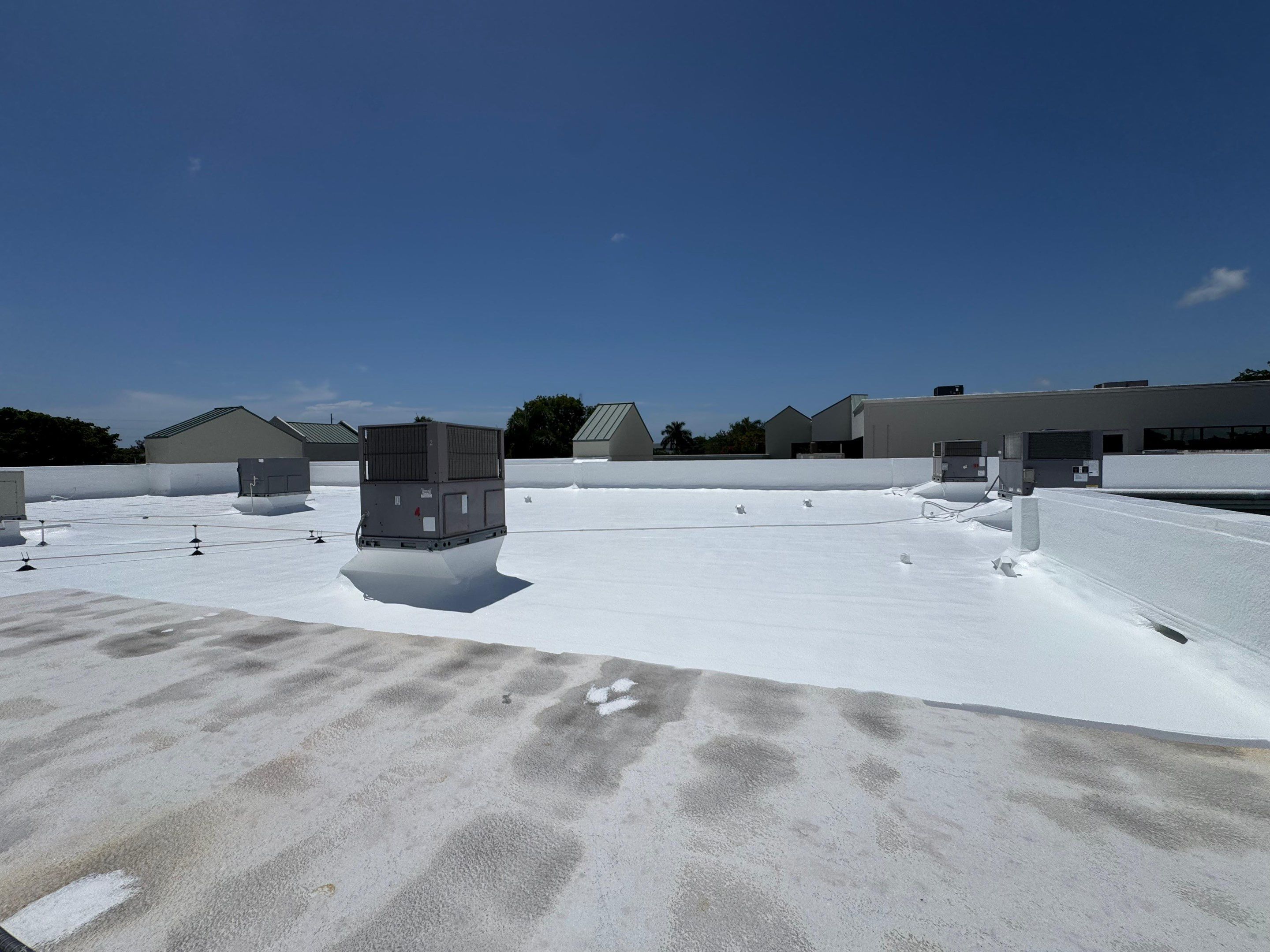 Commercial Flat Roof Restoration and Elastomeric Waterproofing in Delray Beach by Roof King LLC