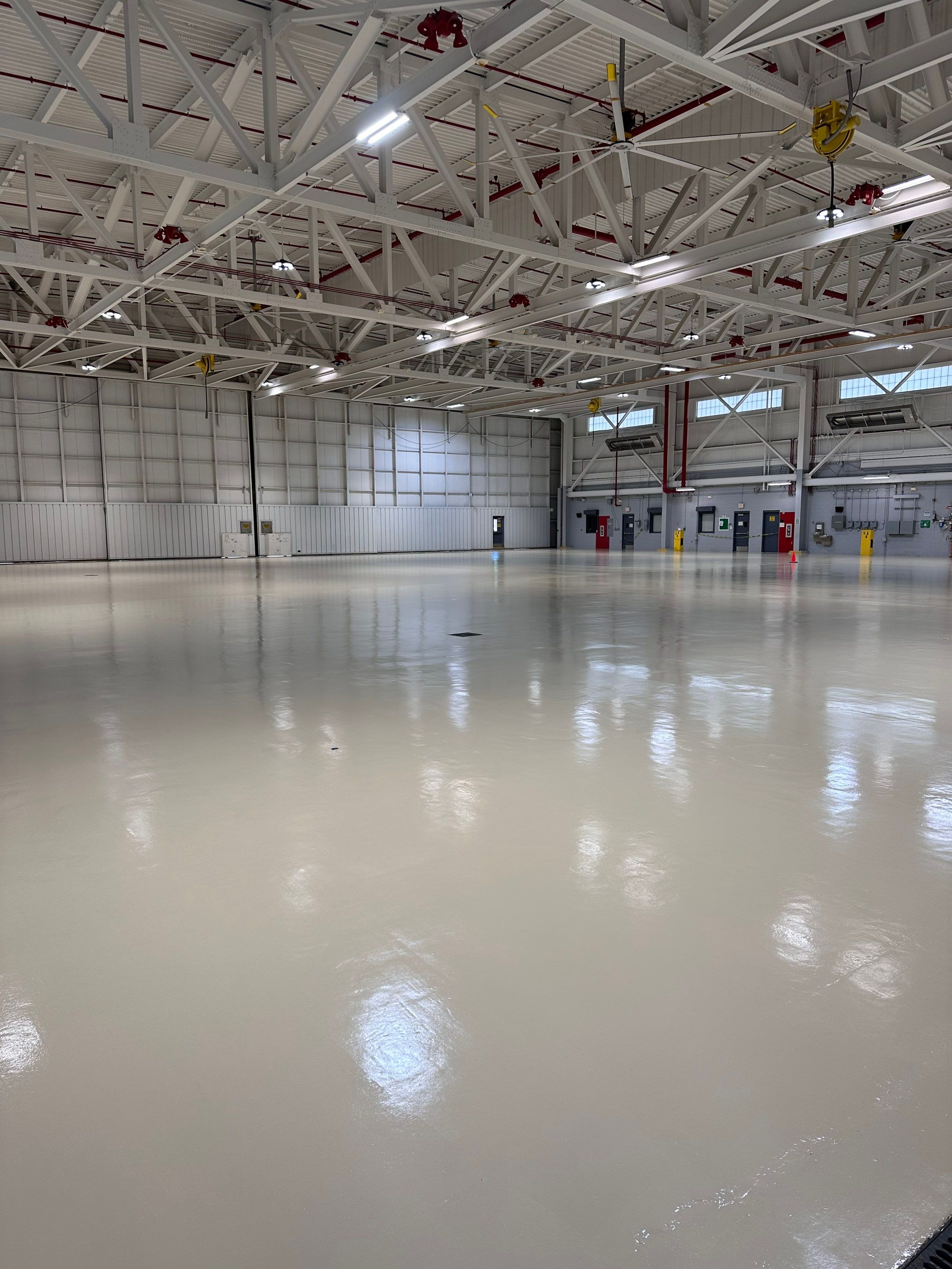 Industrial Epoxy Flooring for Army National Guard Hangar in Mobile by Cornerstone Hard Surface Restoration 