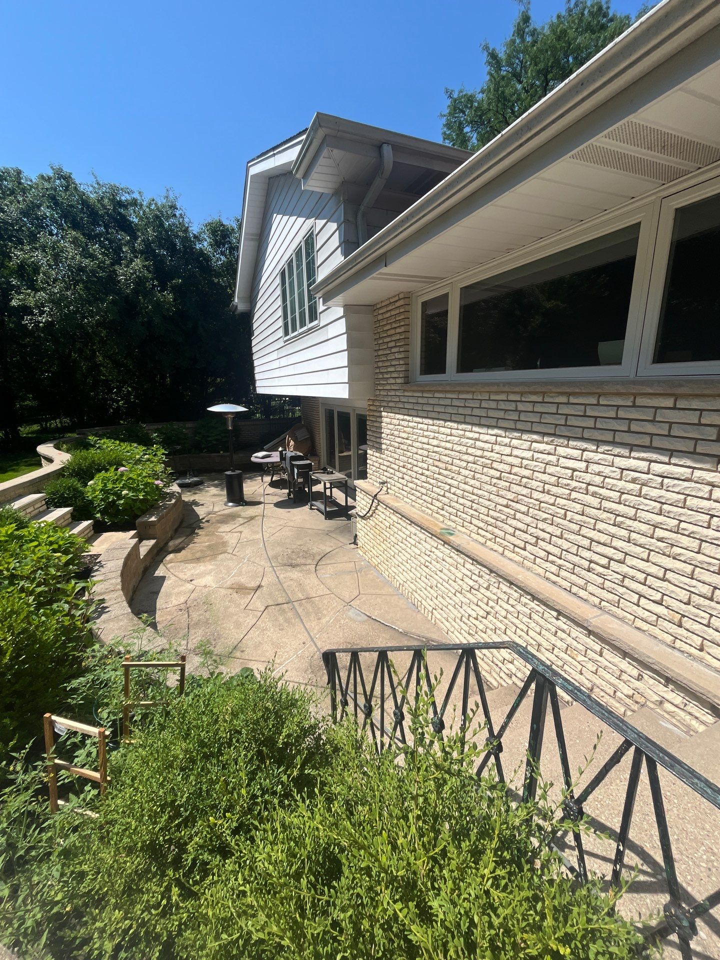 concrete power washing using Algaecide, soft wash soap by Northern Power Washing LLC.