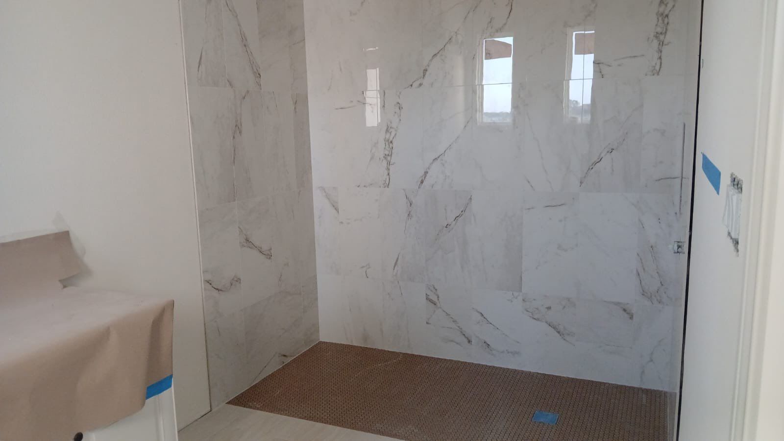 Kitchen and Bathroom Remodel Featuring Custom Stone and Tile in Mico by Mena stone surfaces