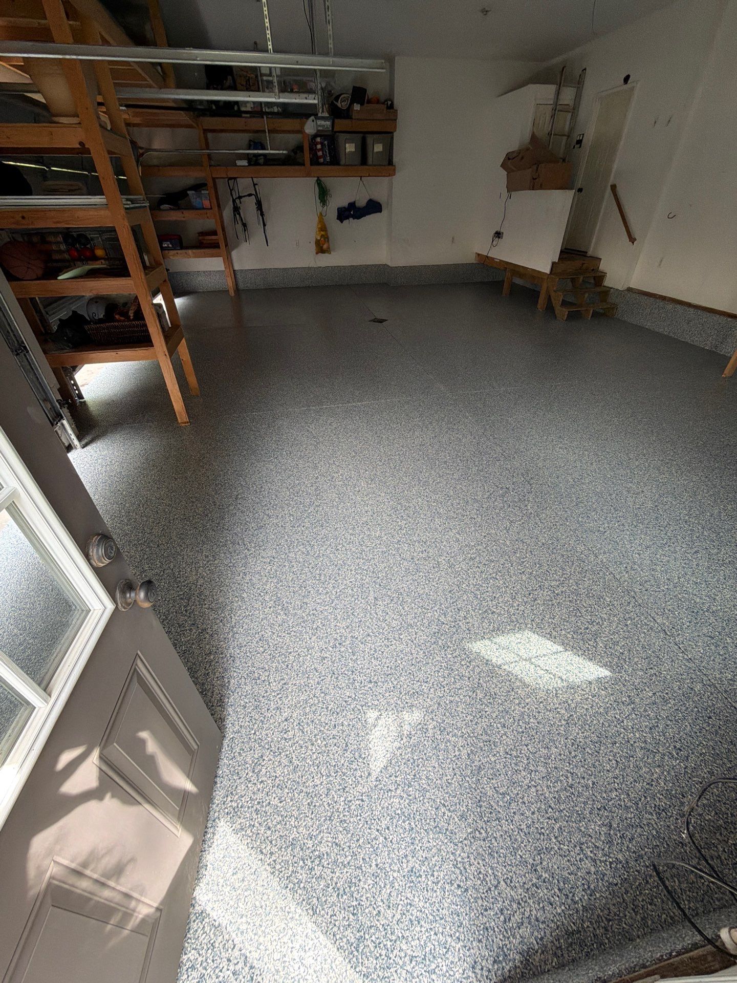 Custom Tidal Wave Epoxy Flake Floor Installation in Norton Shores. by Gordon Painting