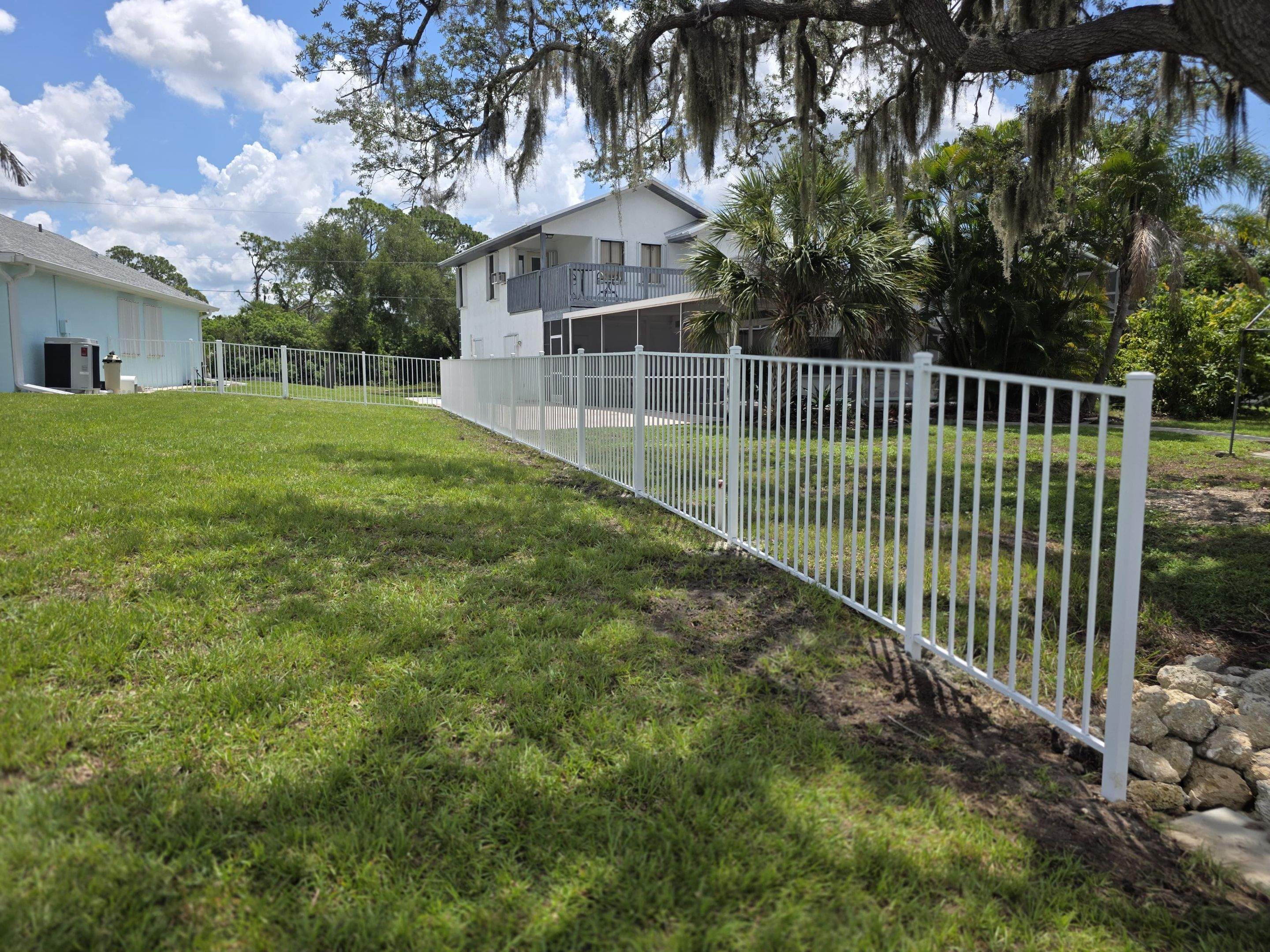 White Aluminum Picket Fence Installation for Port Charlotte Waterfront Home by True Fence LLC