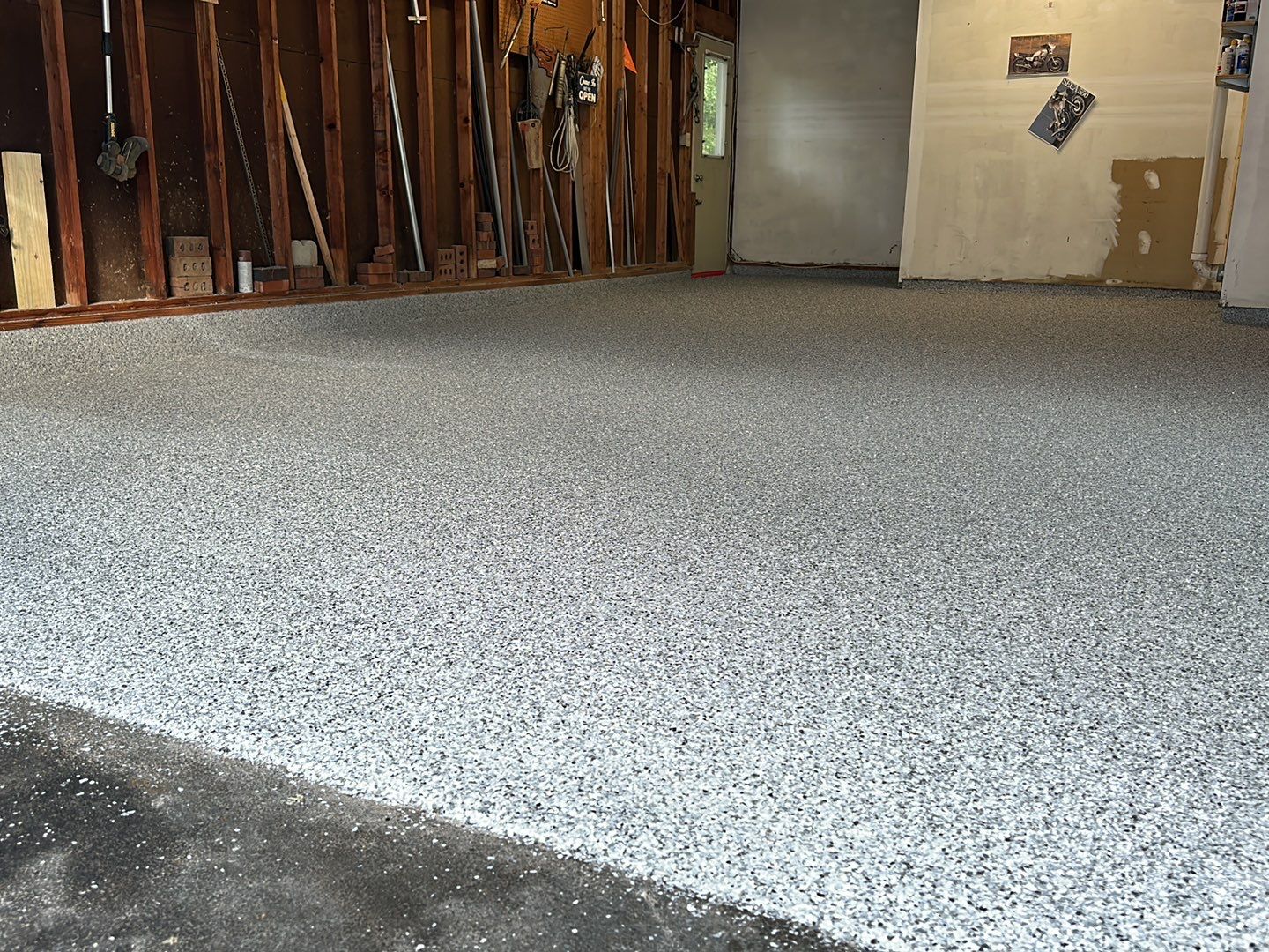Silverado garage floor coating  by NG Masonry & Construction LLC