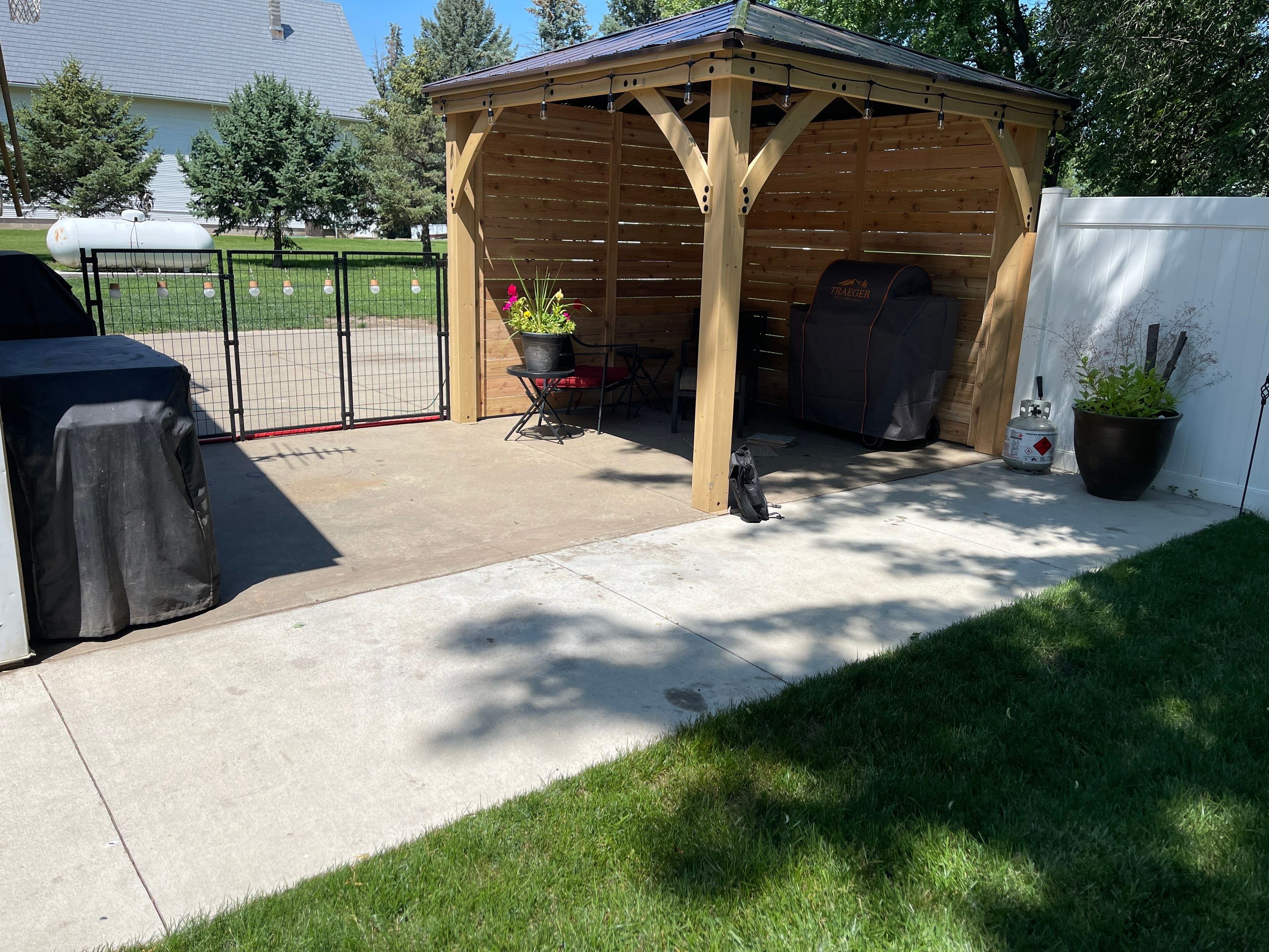 Speckled Epoxy Concrete Patio Coating Installation in Hurley by Select Painting, Coatings & Garage Cabinets