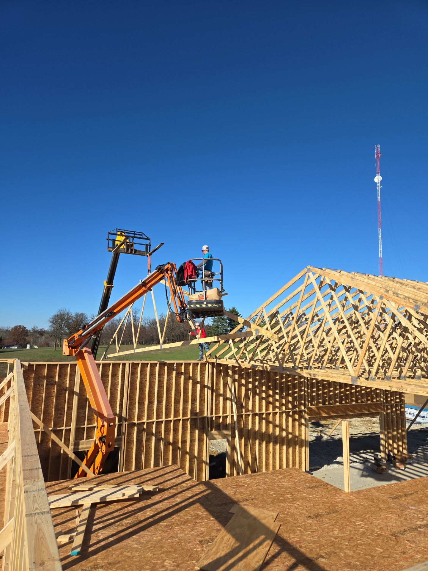 New Home construction w/ board and batten sides and metal roof  by Miles Construction 