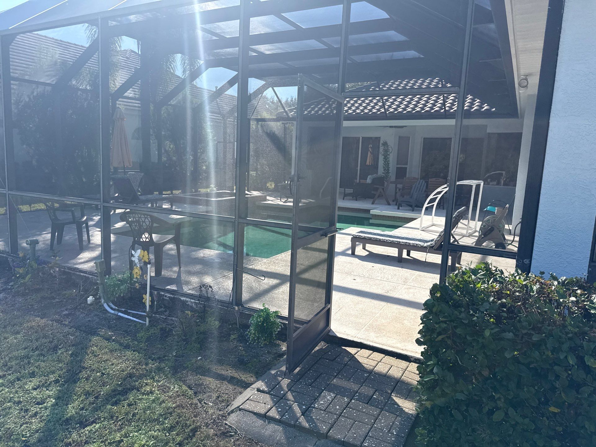 Painted Pool Deck, Lanai & Pool Cage Cleaning in River Club South – Bradenton, FL by Sunshine AquaWash