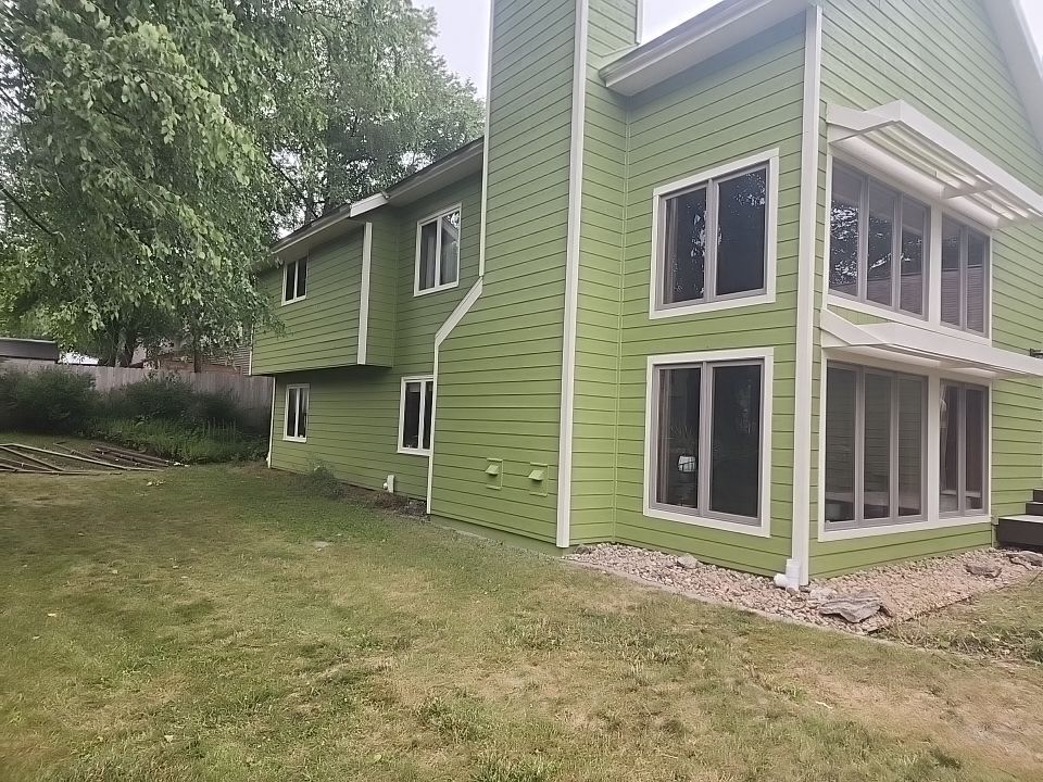 Complete house repaint to a different color  by Cutting edge painting 