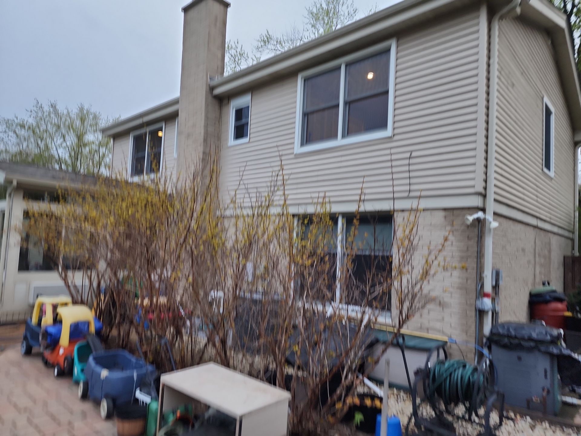 roof washing using Algaecide, soft wash soap by Northern Power Washing LLC.