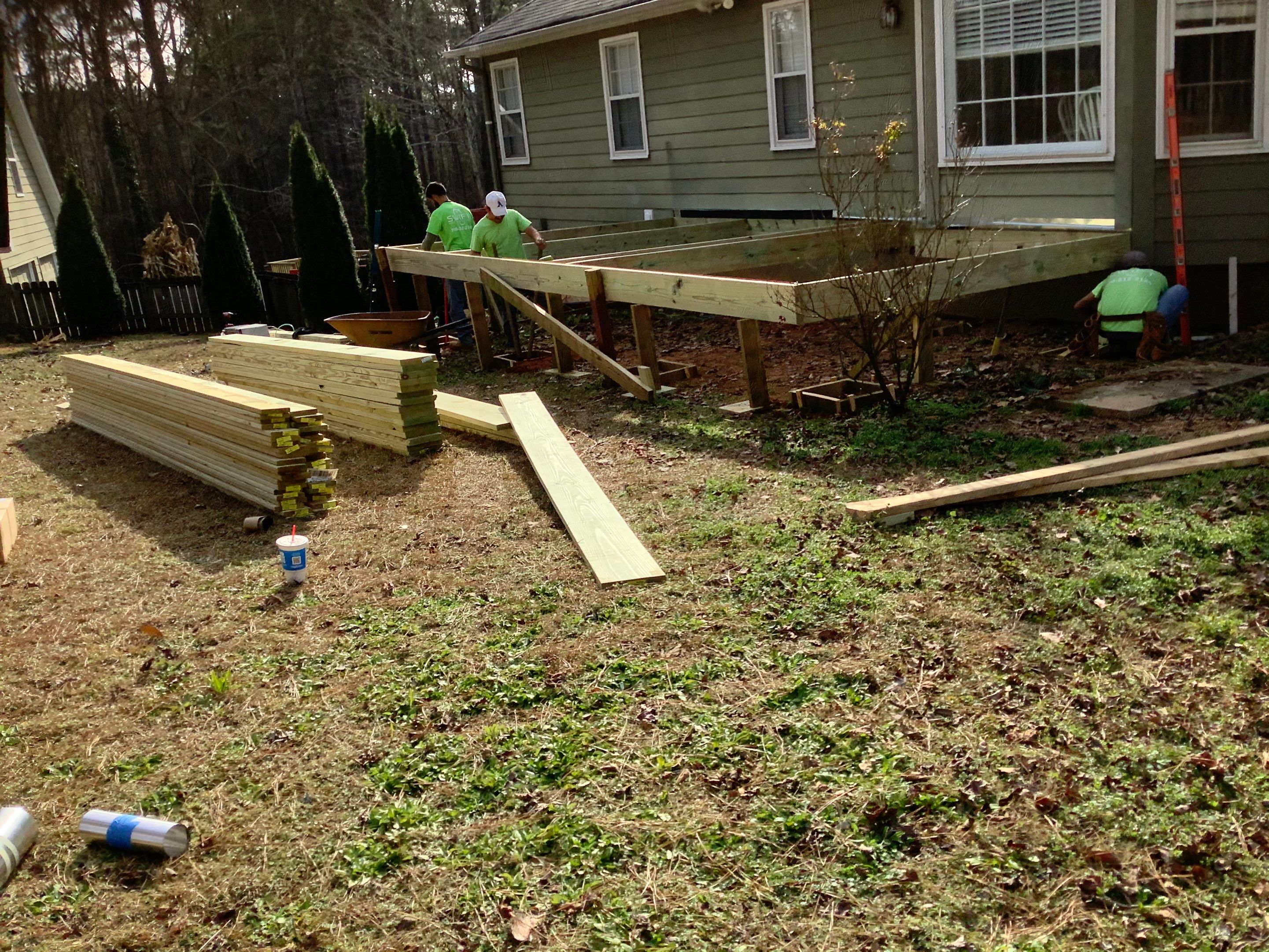 Raised Pressure-Treated Wood Deck Construction in Dallas, Georgia by Swift Home Renovations 