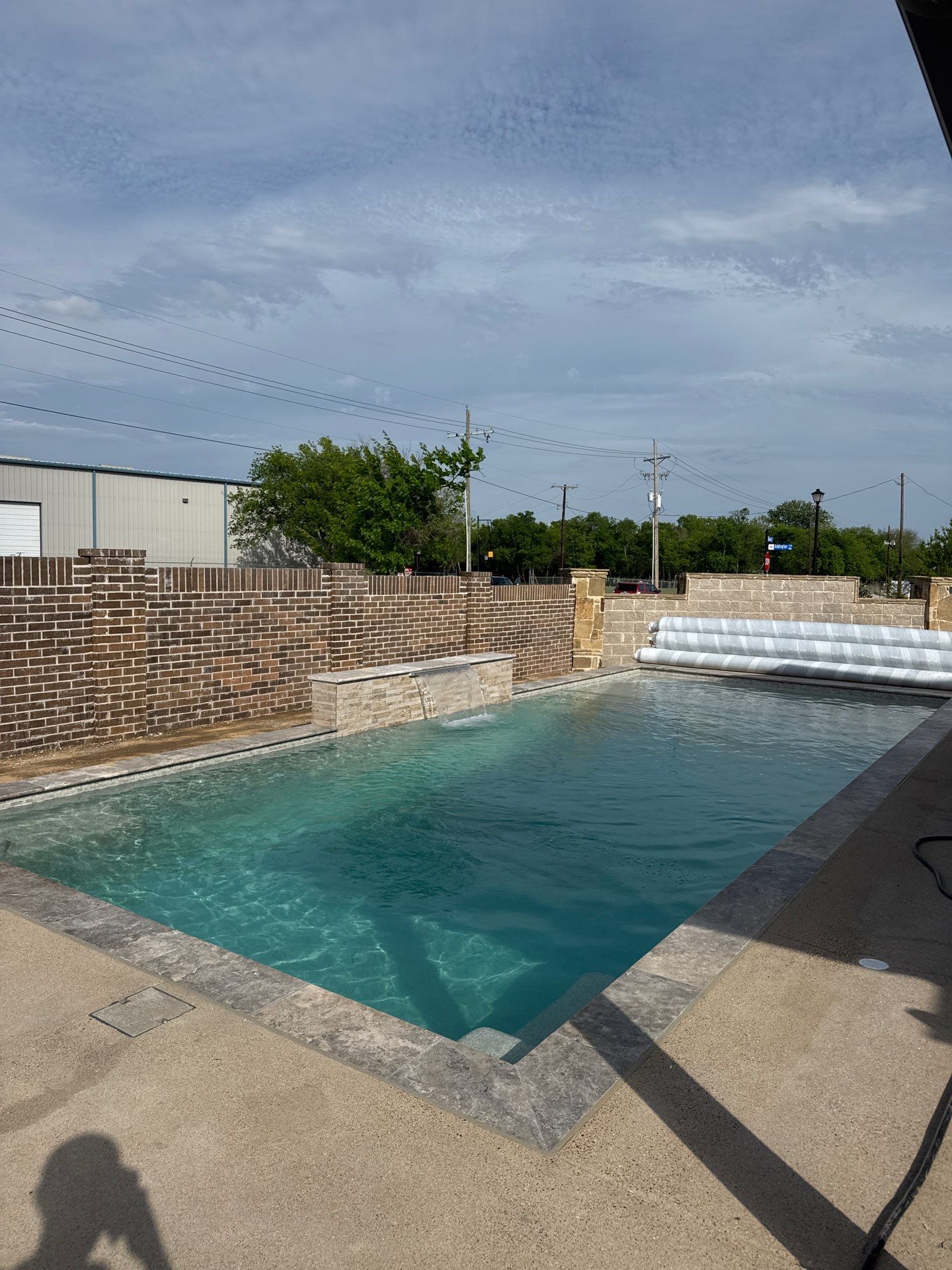 Rectangular Pool with Tanning Ledge and Waterfall by Pinnacle Pools and Spas - DFW