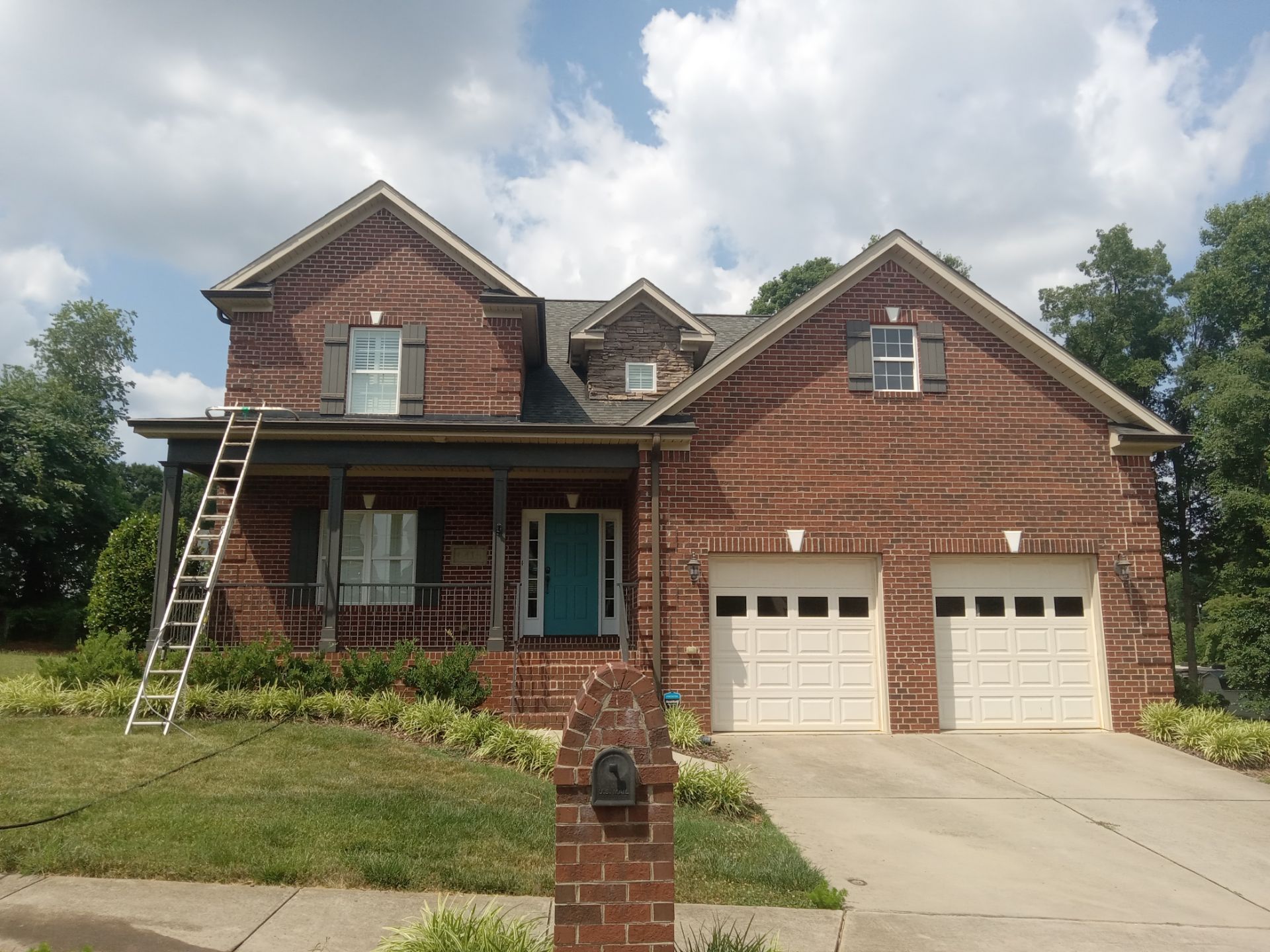 pressure washing exterior surfaces like siding driveway walkway removing dirt buildup for residential property cleaning