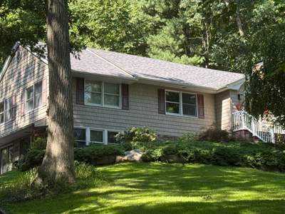 Midnight Plum Roof Replacement on Split-Level Residence in Melville