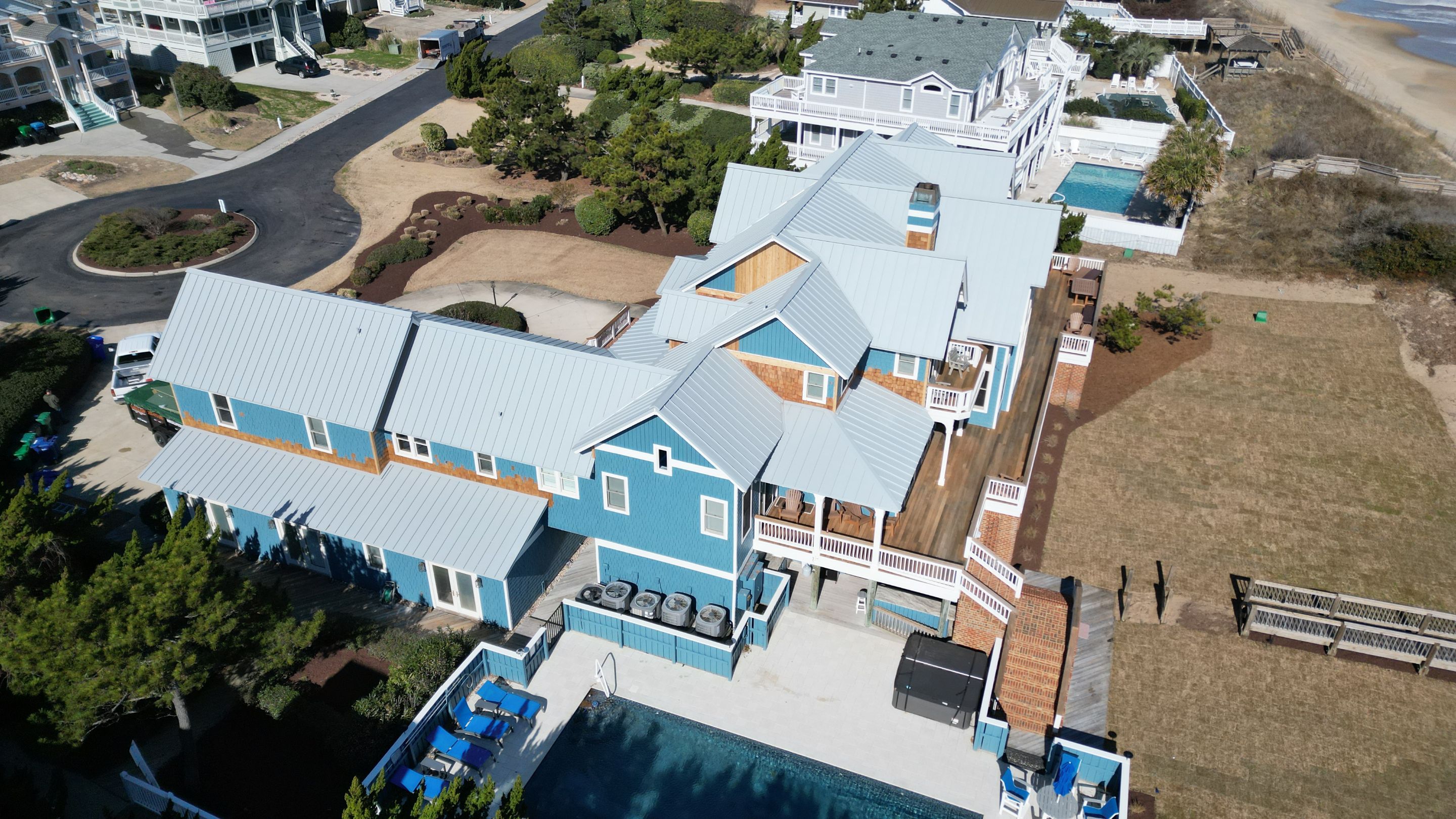 Large Metal Roof Transformation by Gallop Roofing & Remodeling, Inc.